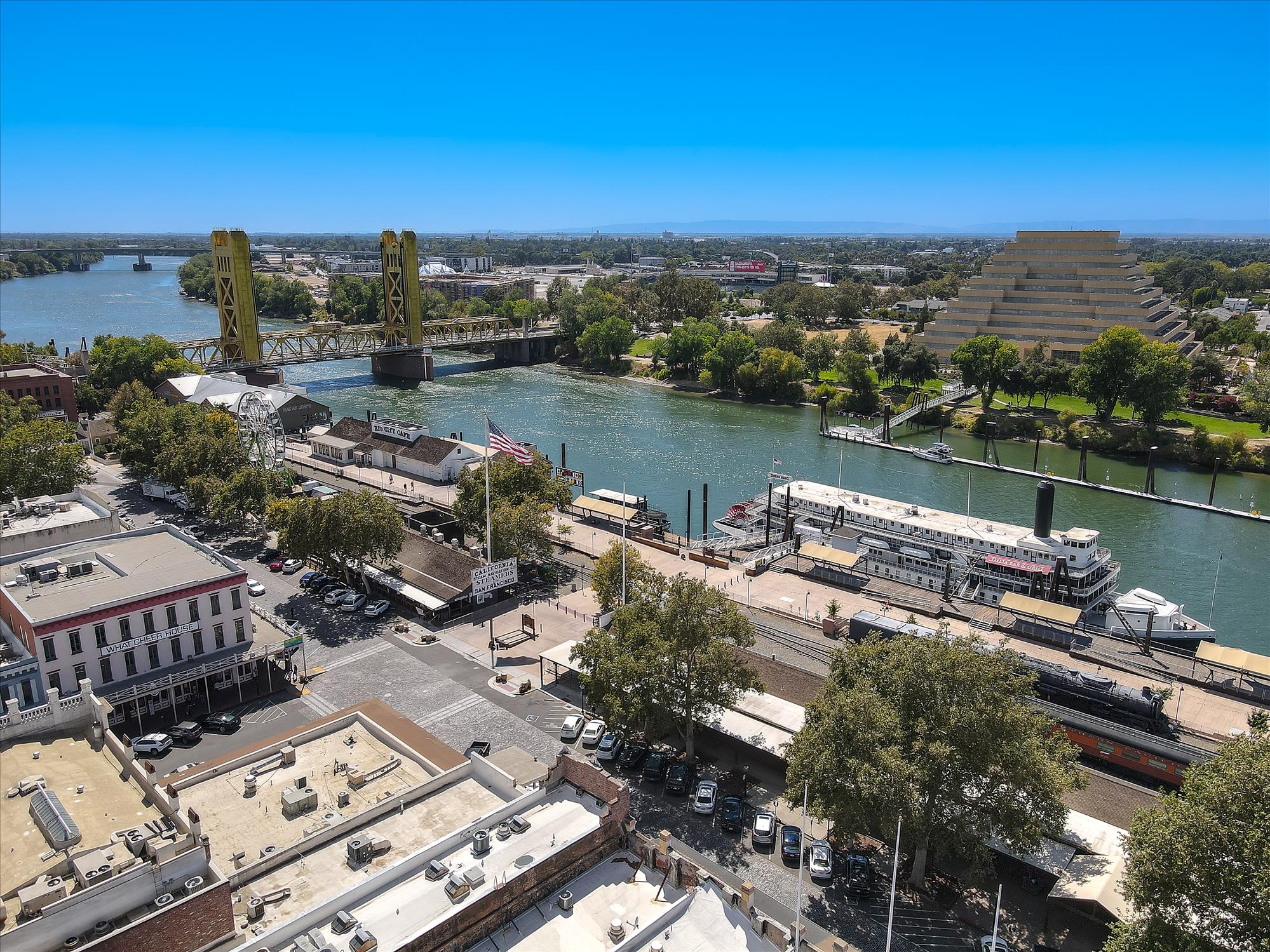 A body of water with buildings and trees around it.