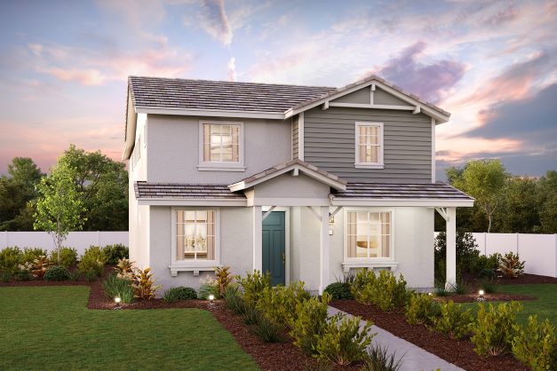 A house with a yard and a fence.