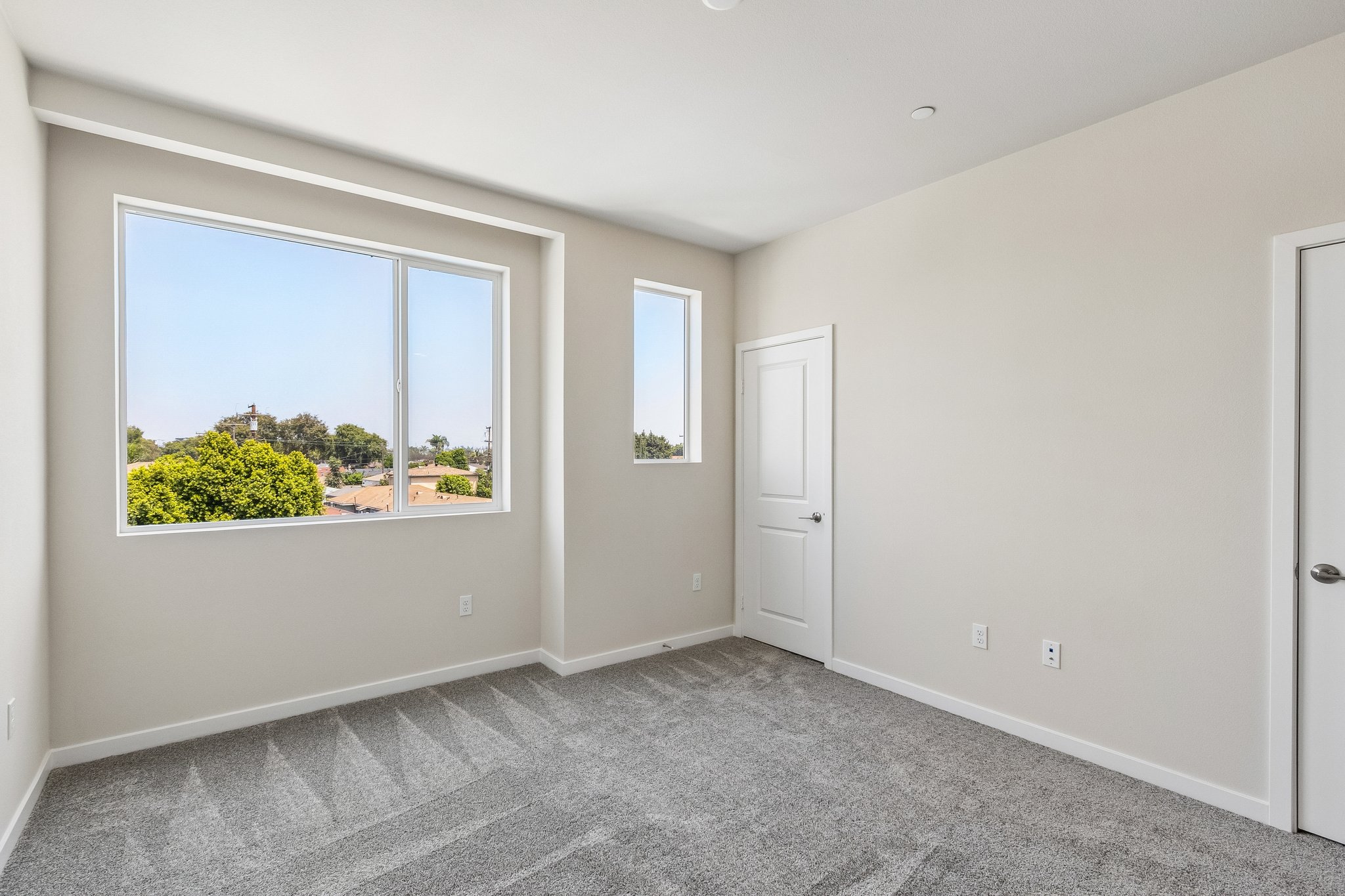 A room with a window and a door.