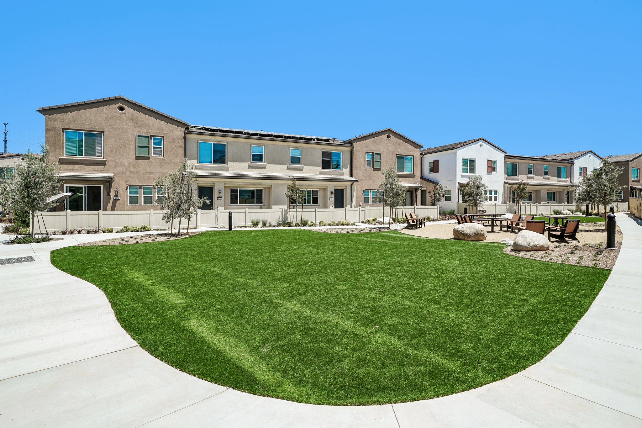 A large building with a lawn in front of it.