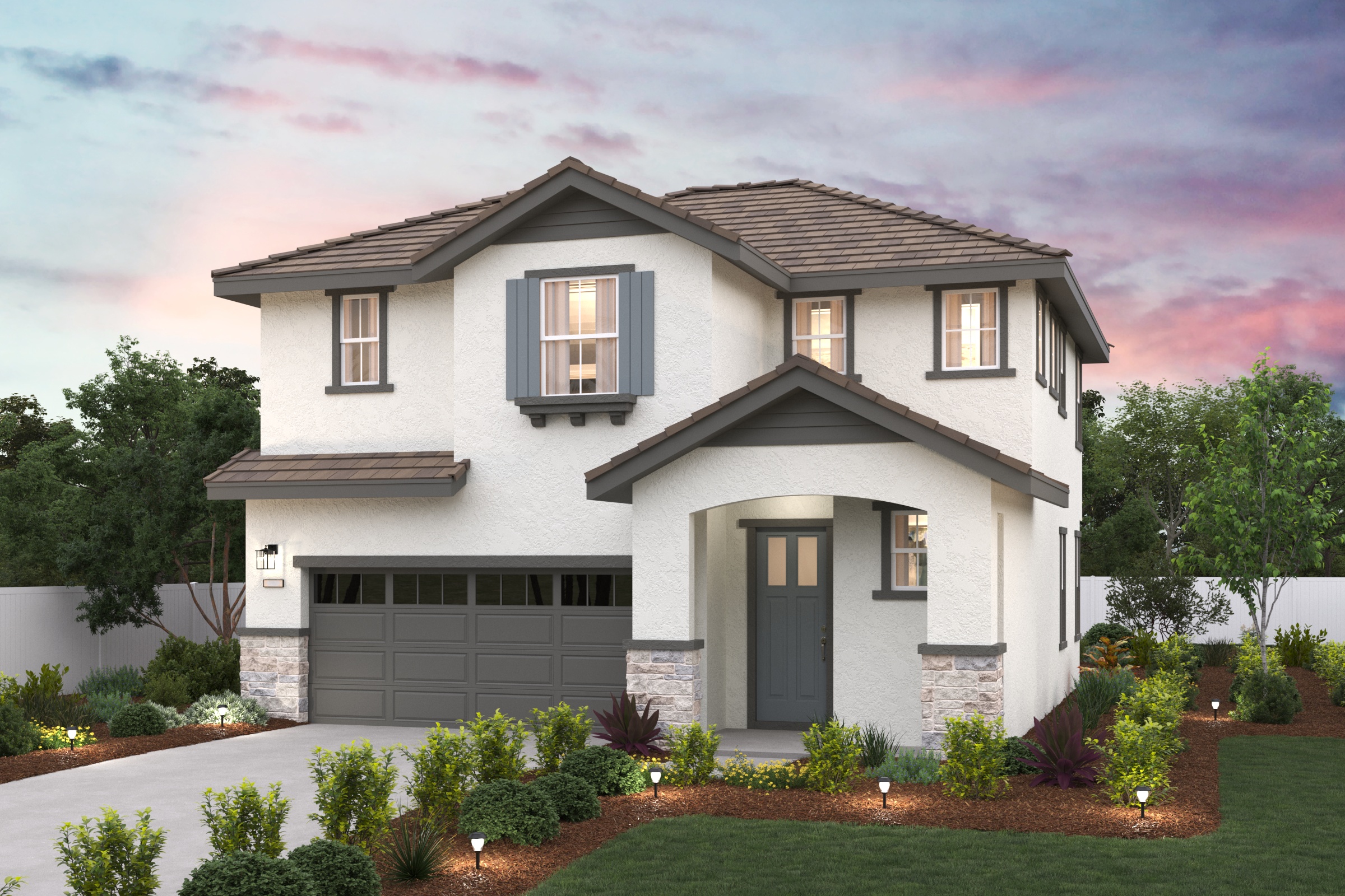 A house with a garage and trees.