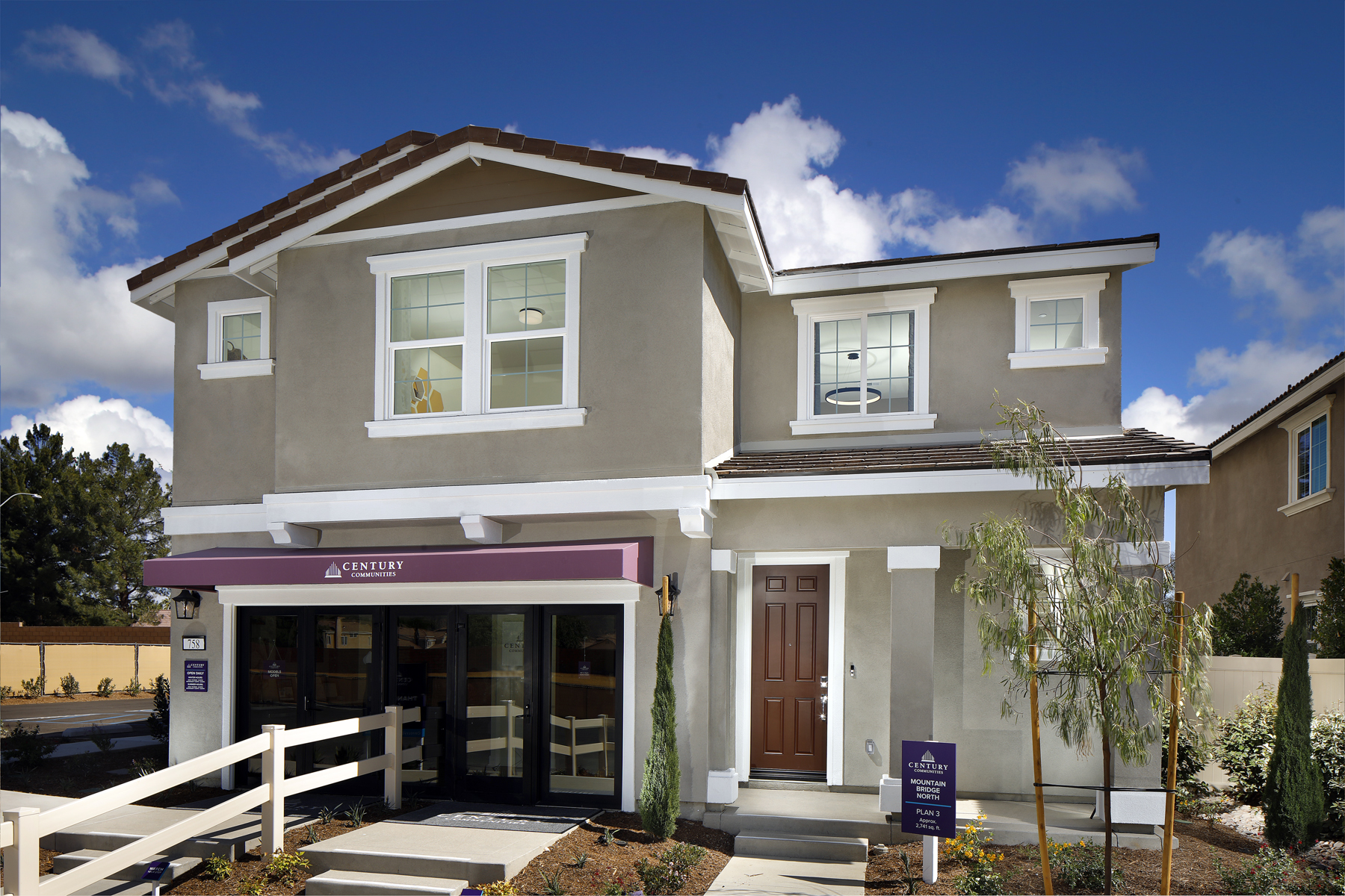 A white house with a fence.