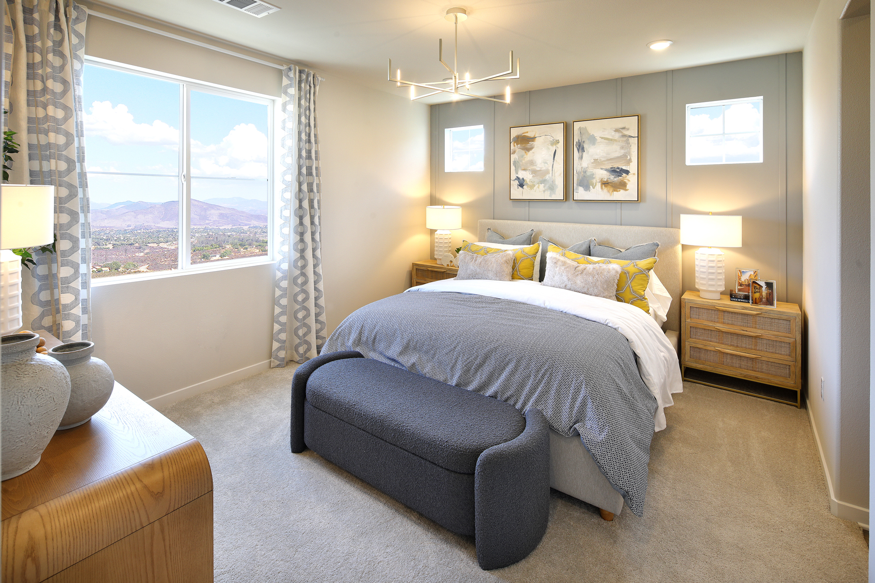 A bedroom with a large window.