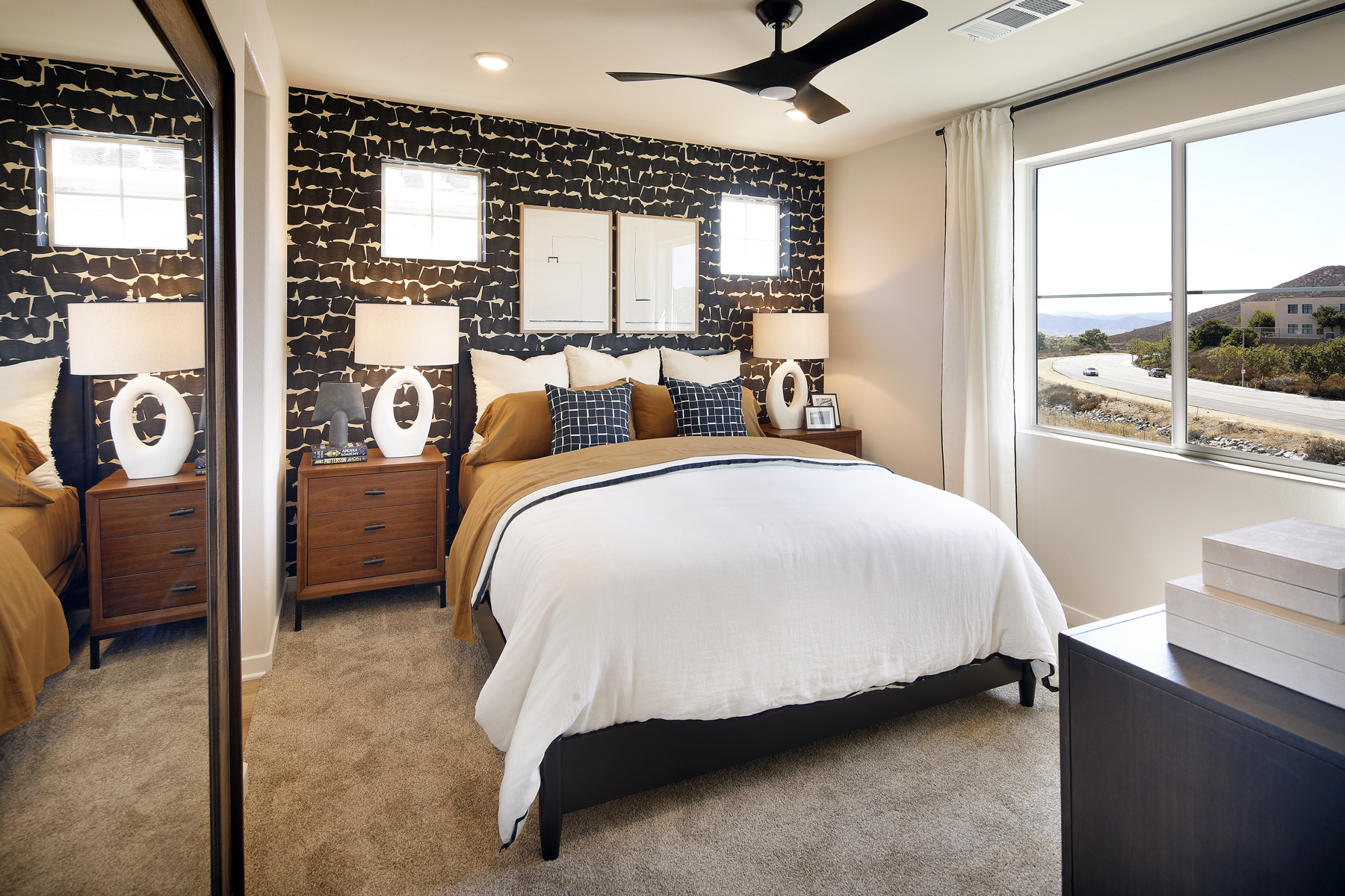 A bedroom with a large bed.