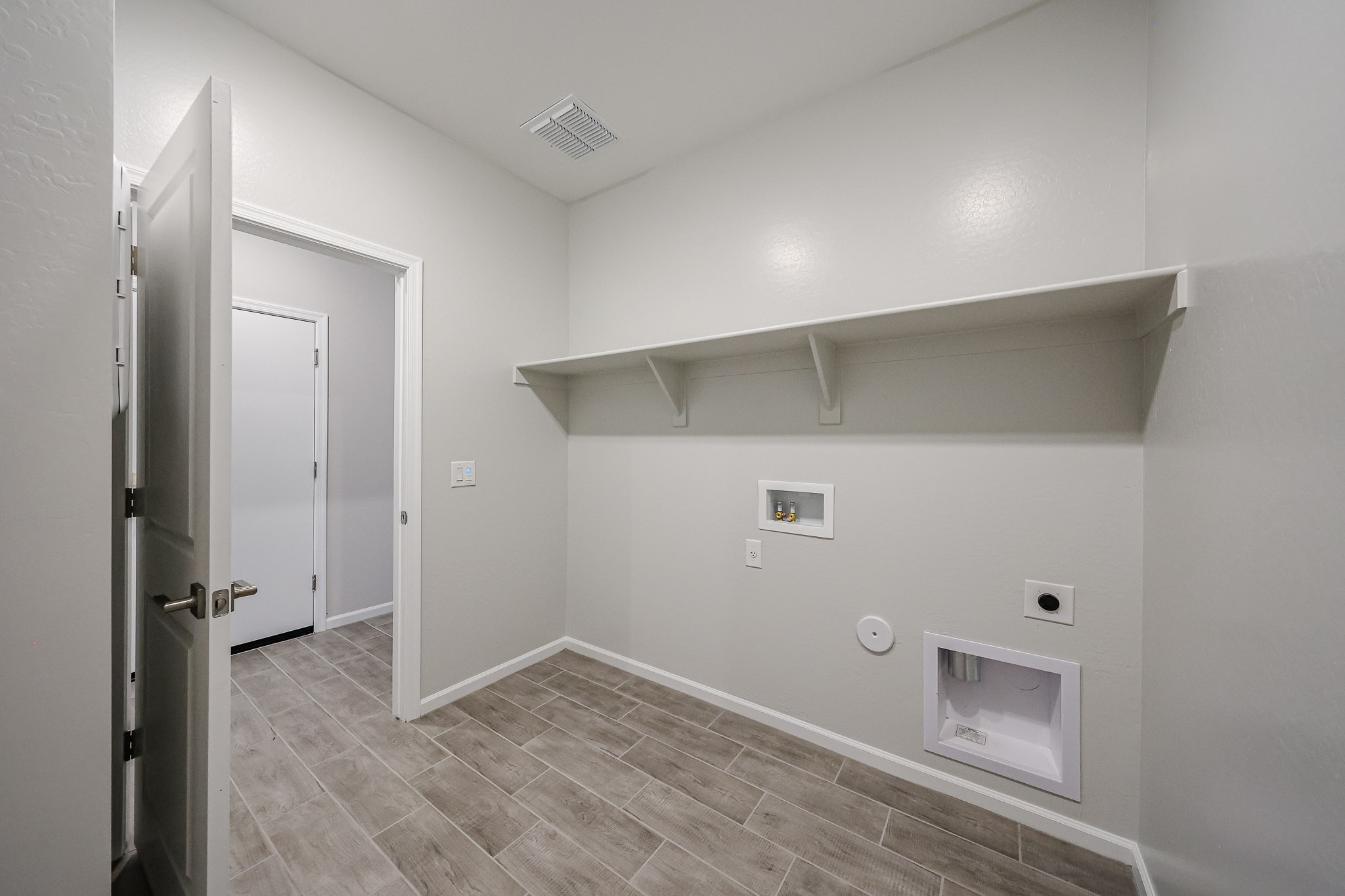 A room with a tile floor and a tile floor.