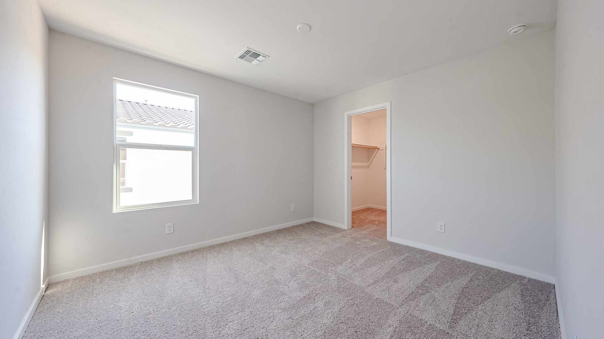 A room with a door and a window.