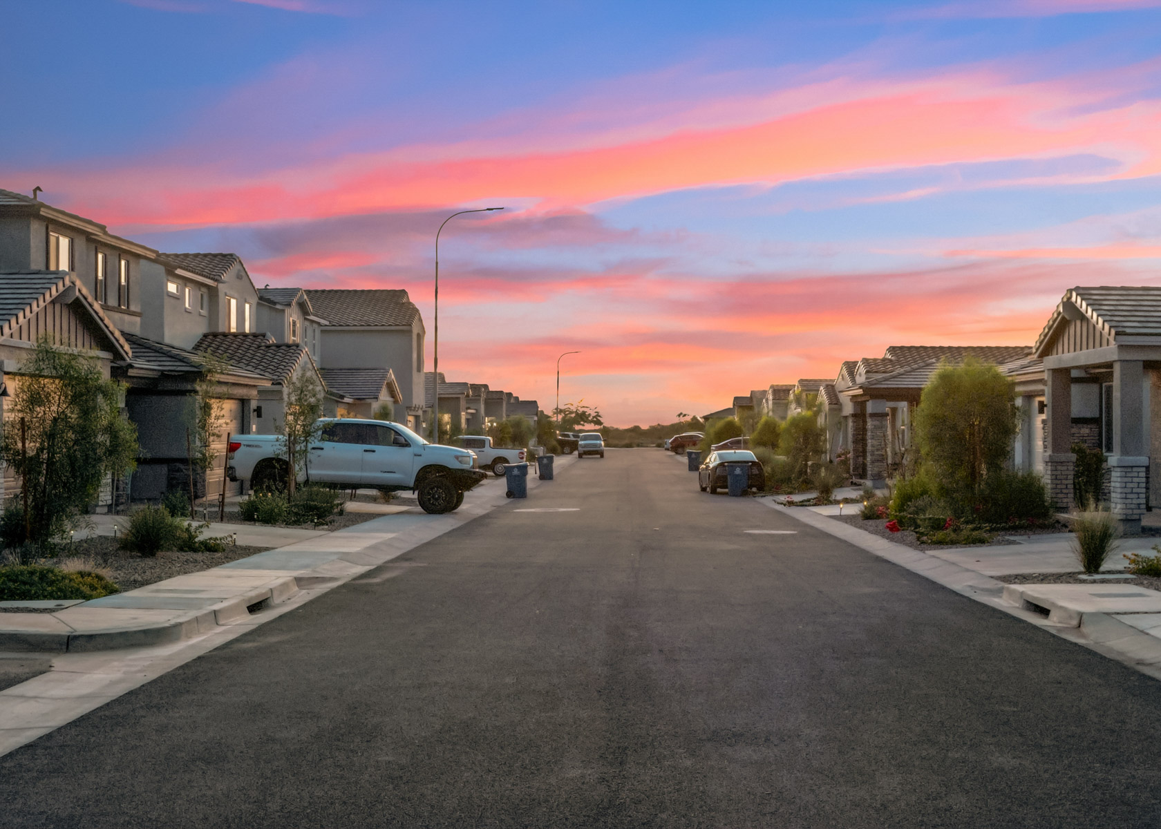 A street with cars parked along it.