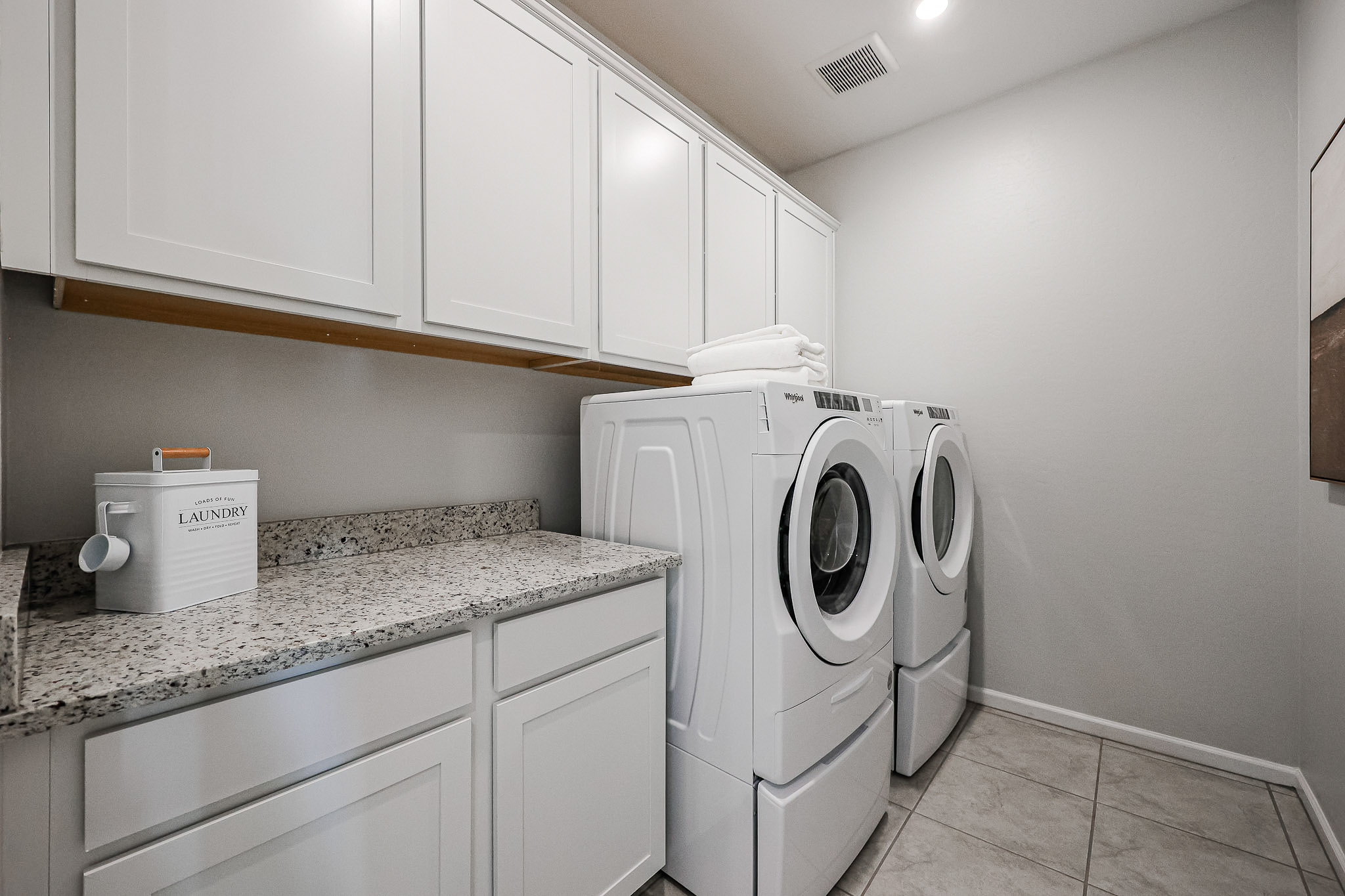 A washing machine in a kitchen.