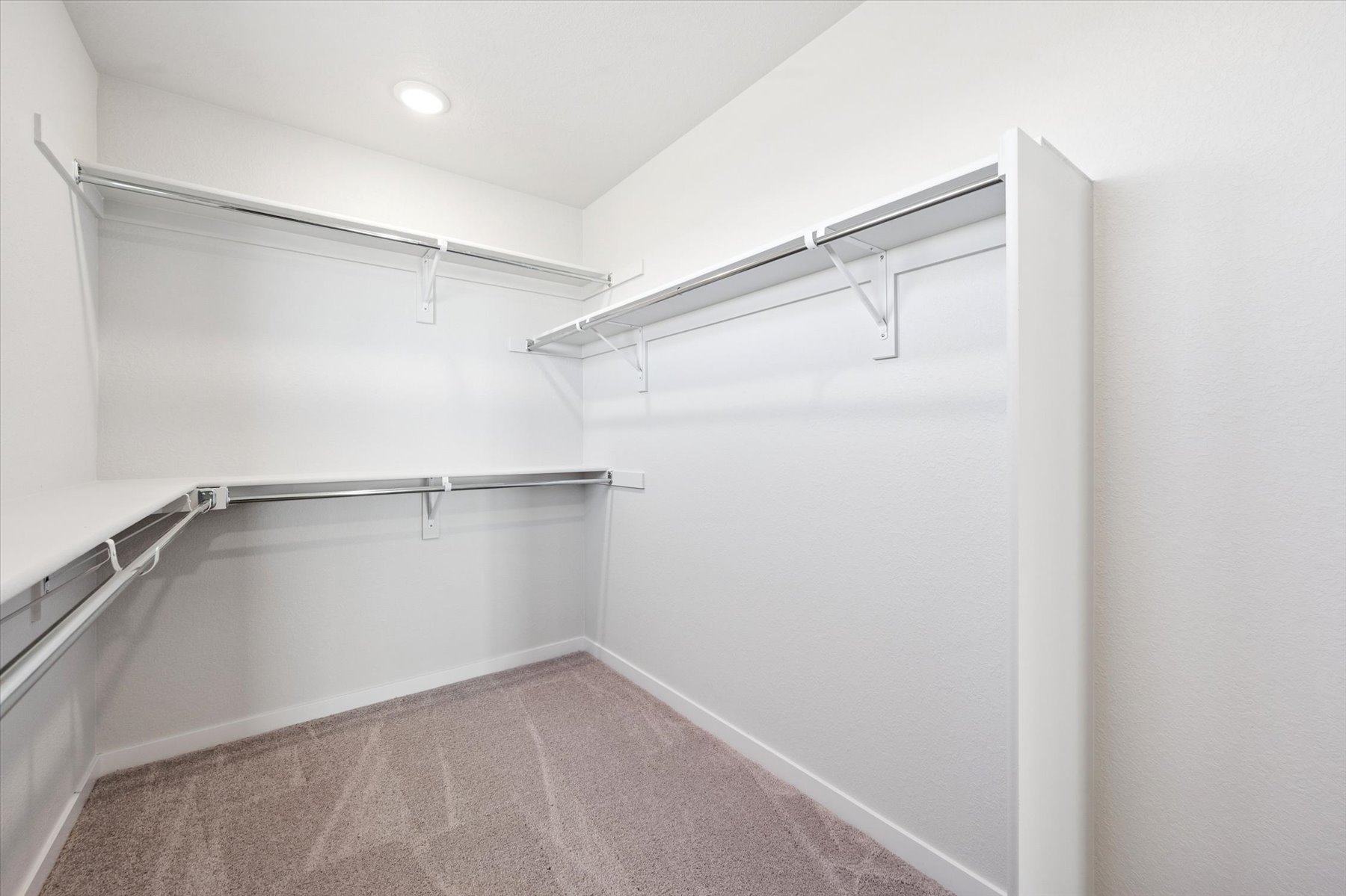 A white room with a staircase.