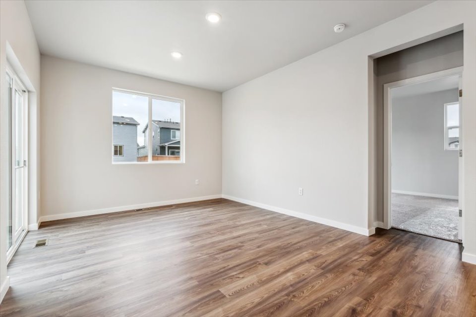 A room with a wood floor and a wood floor.