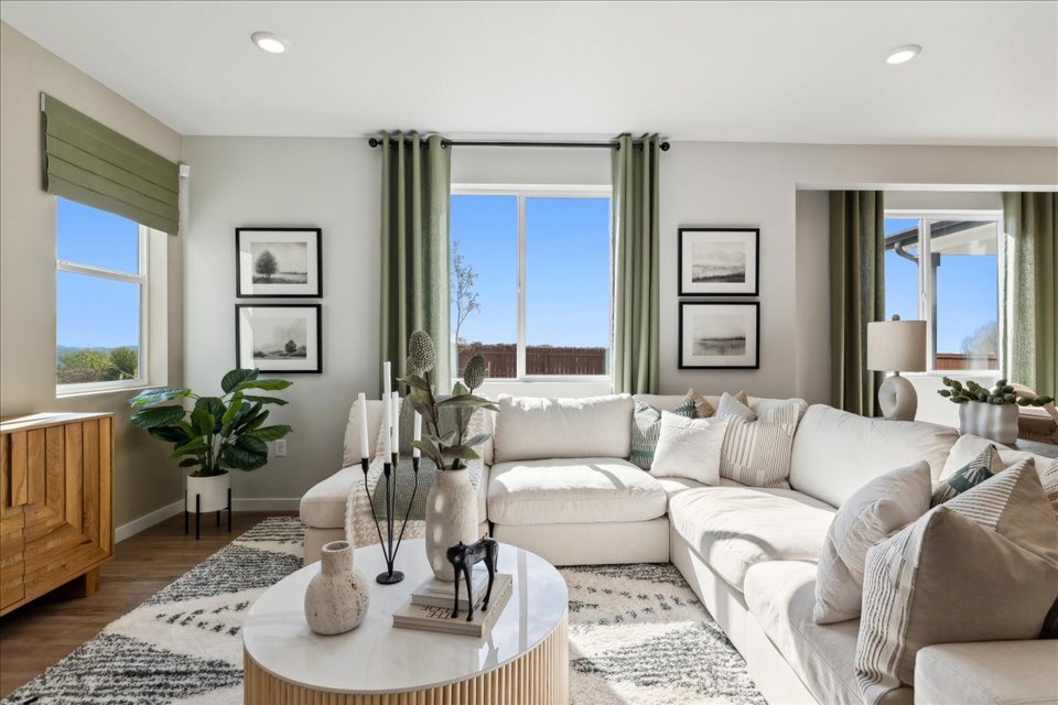 A living room with a couch and a table.