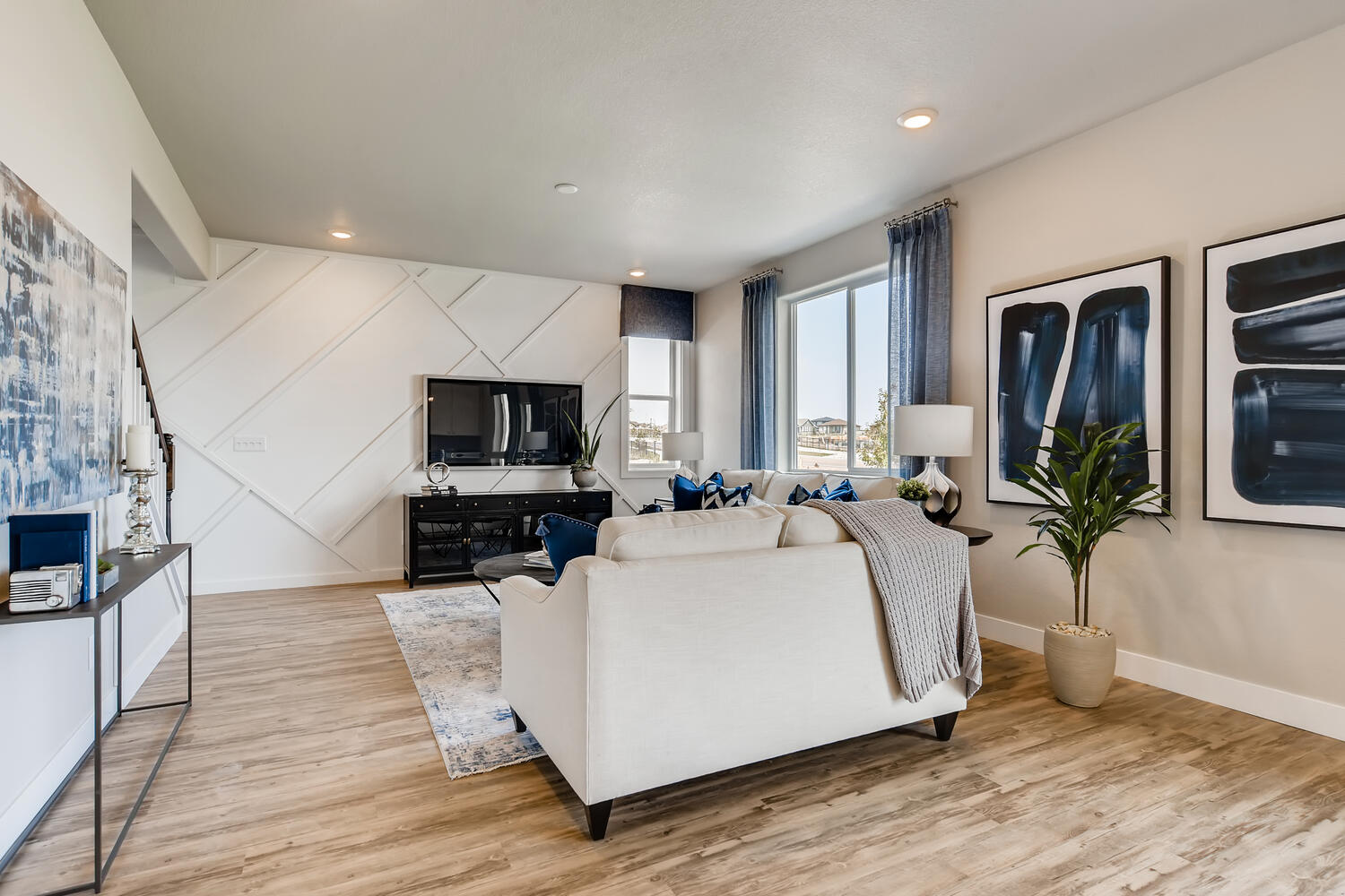 A living room with a white couch.