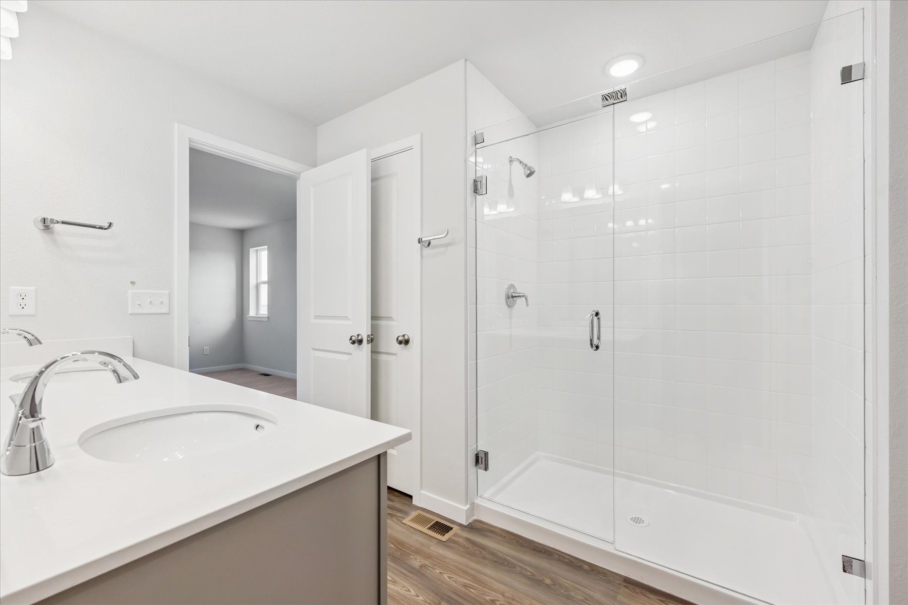 A bathroom with a glass shower.