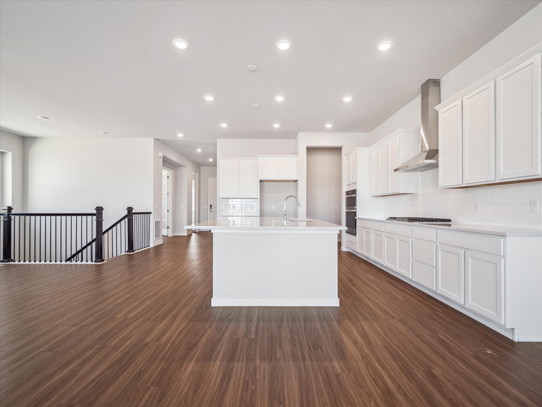 A large kitchen with white cabinets.
