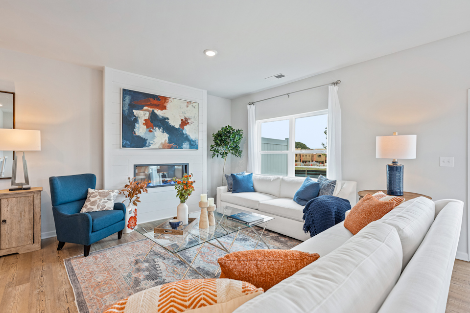 A living room with a couch and chairs.