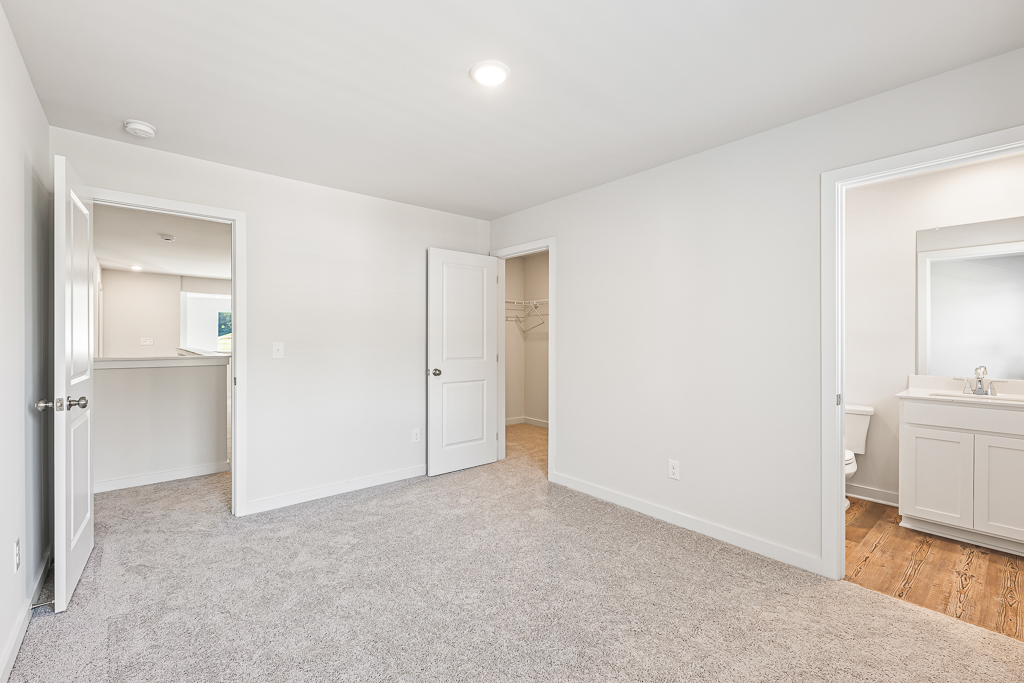 A bathroom with white walls.