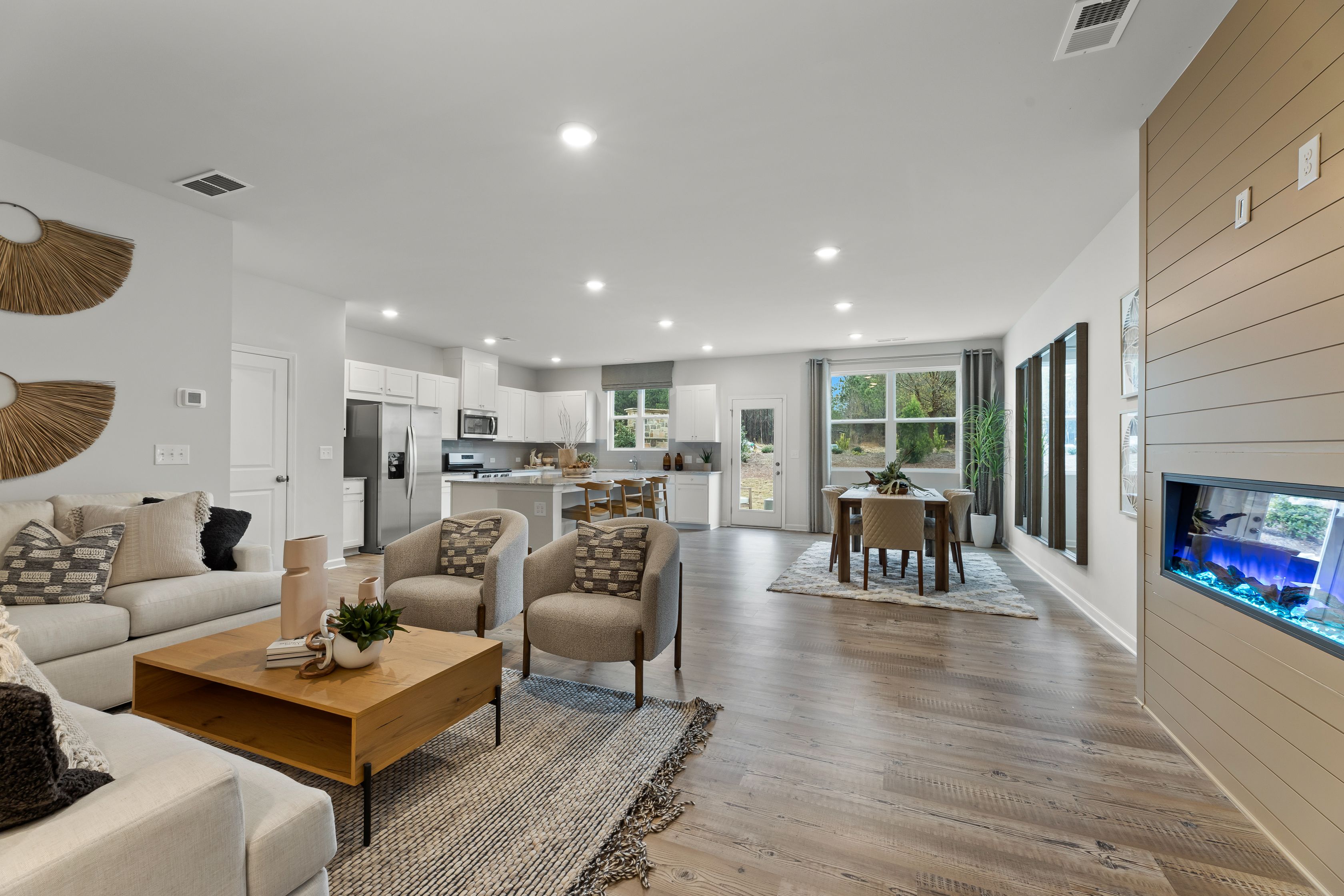 A living room with a wood floor.