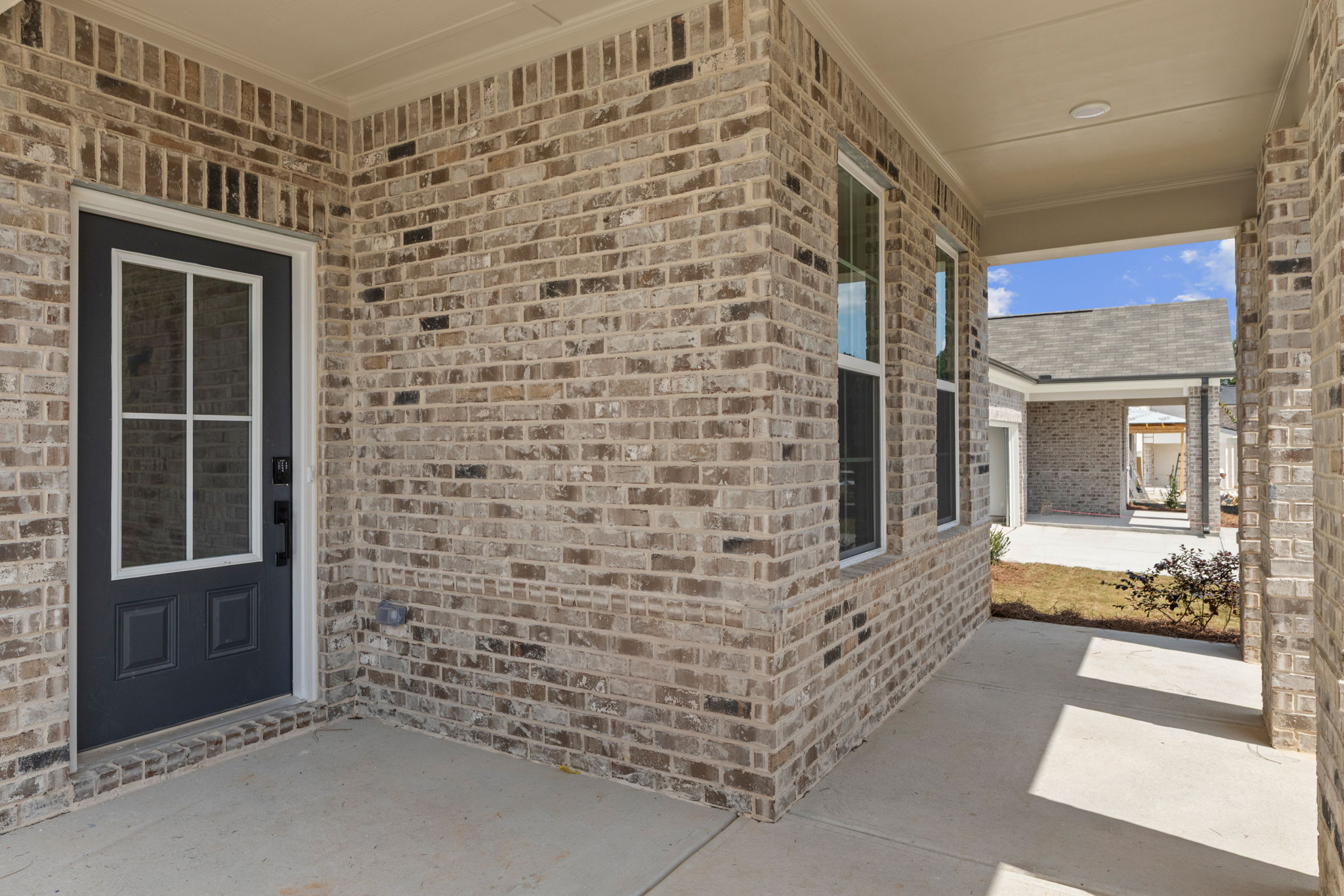 A brick building with a door.