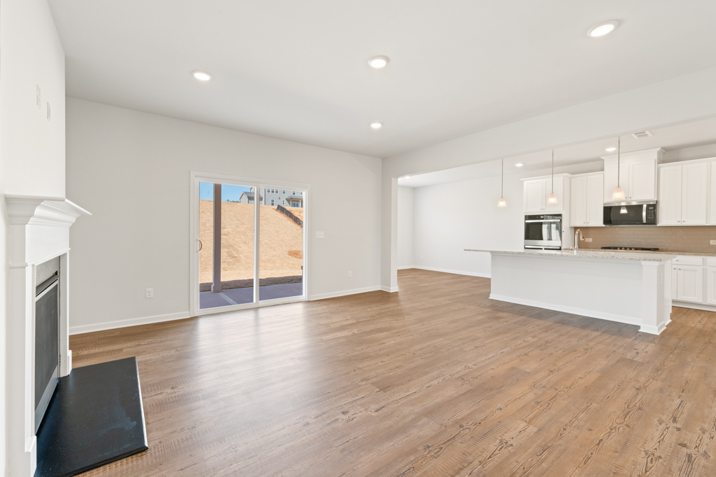 A large kitchen with white walls.