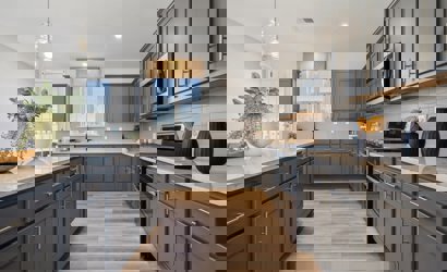 A kitchen with black cabinets.