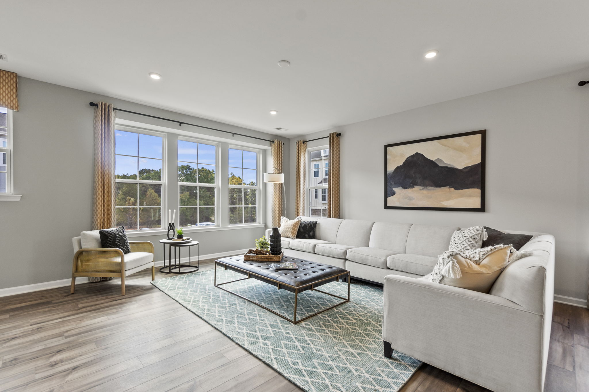 A living room with a large window.