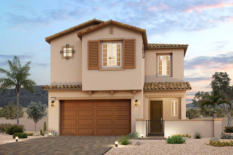 A house with a garage and trees.