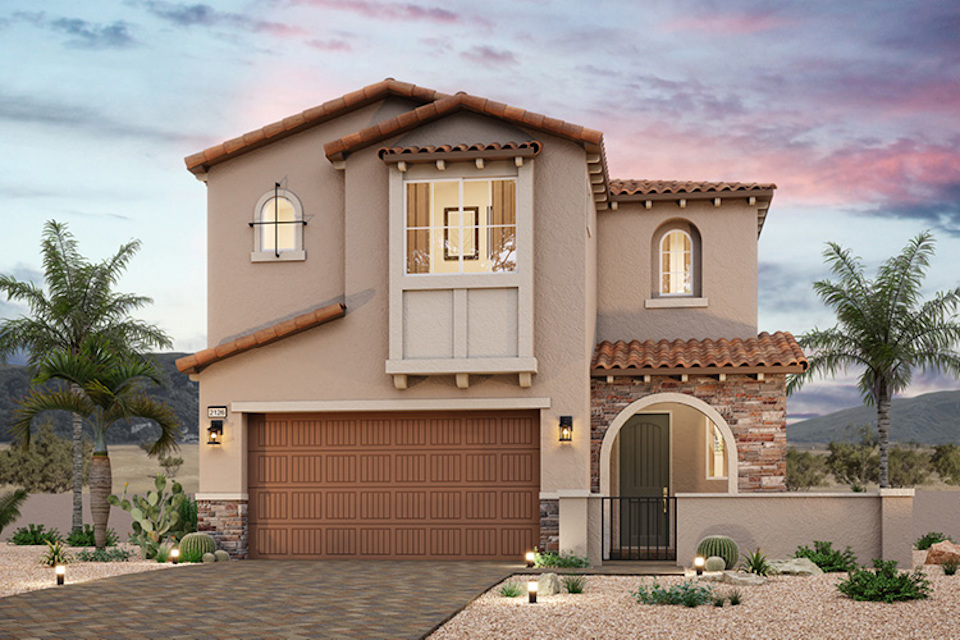 A house with a garage and a brick driveway.