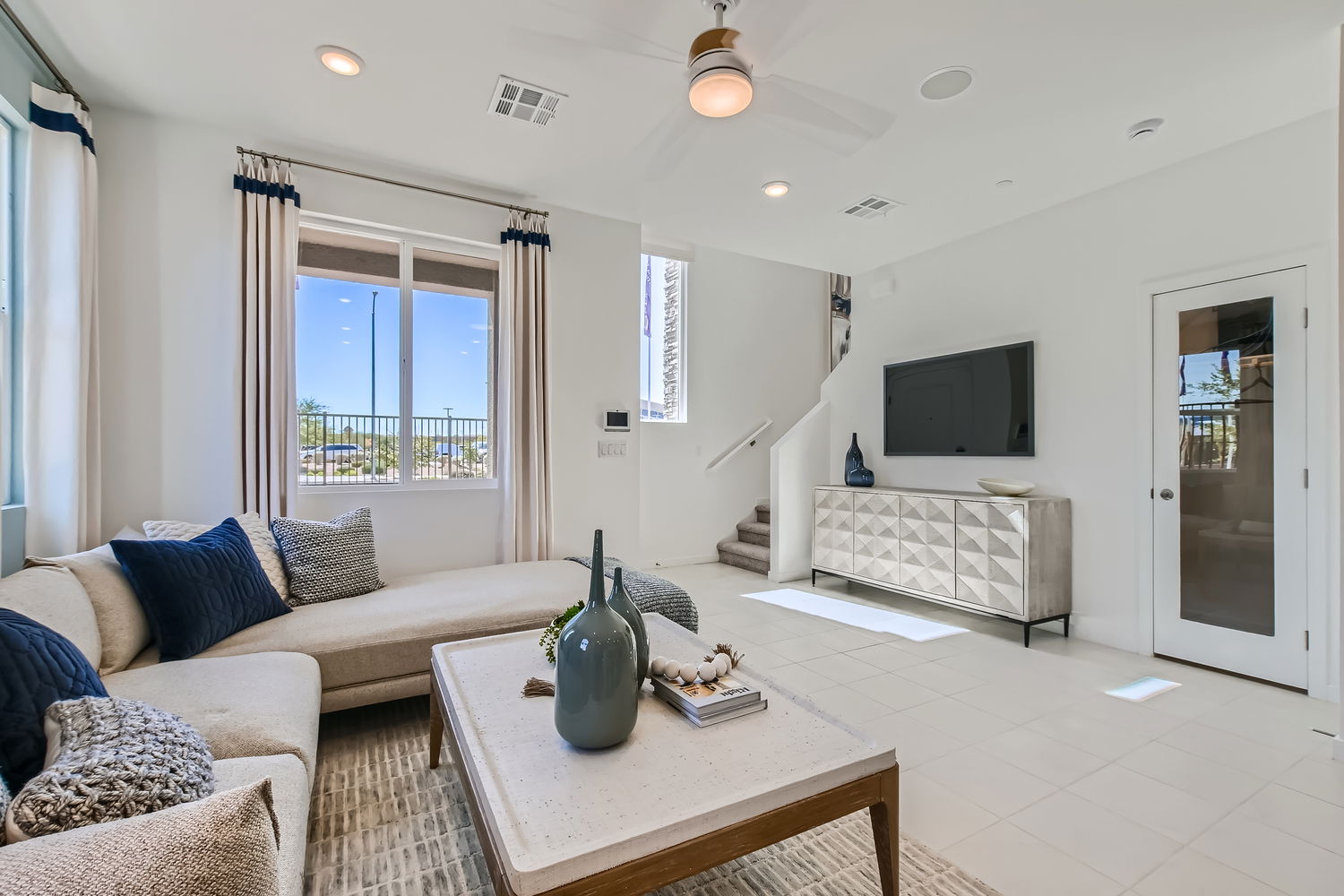 A living room with a tv and couches.