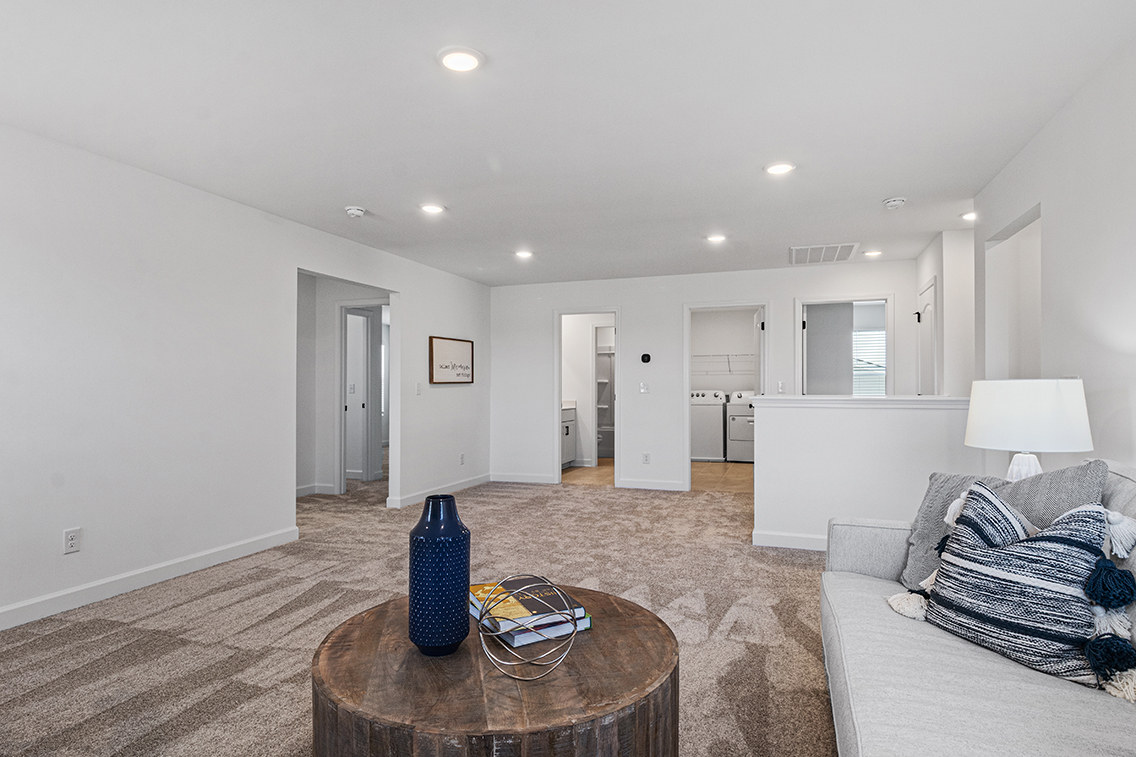 A living room with a couch and a coffee table.