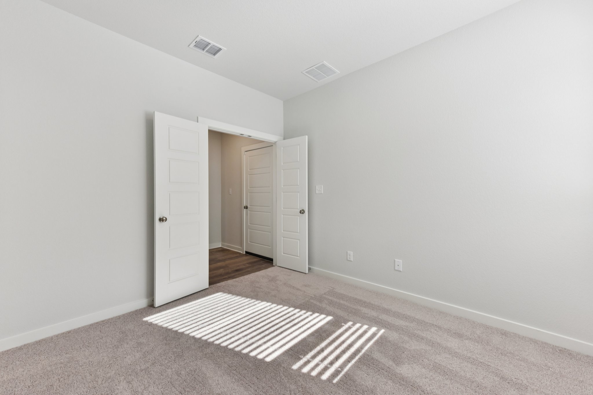 A room with white doors.