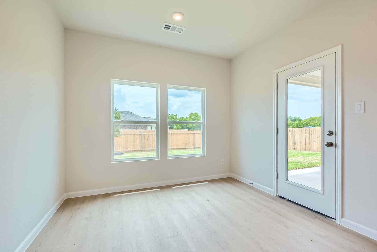 A room with a door and windows.