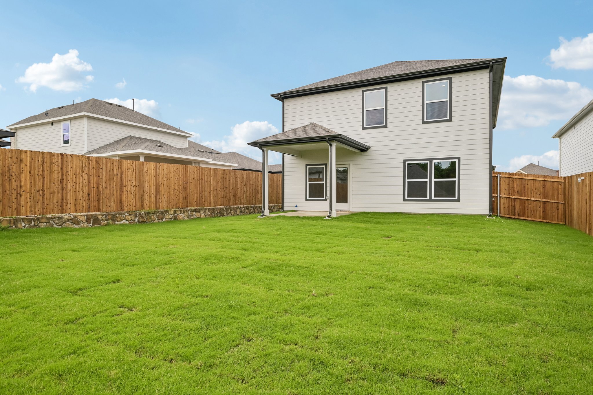A house with a grass yard.
