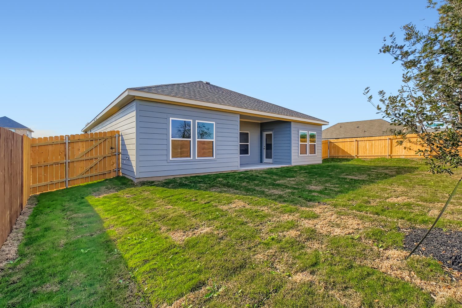 A small house with a fence.