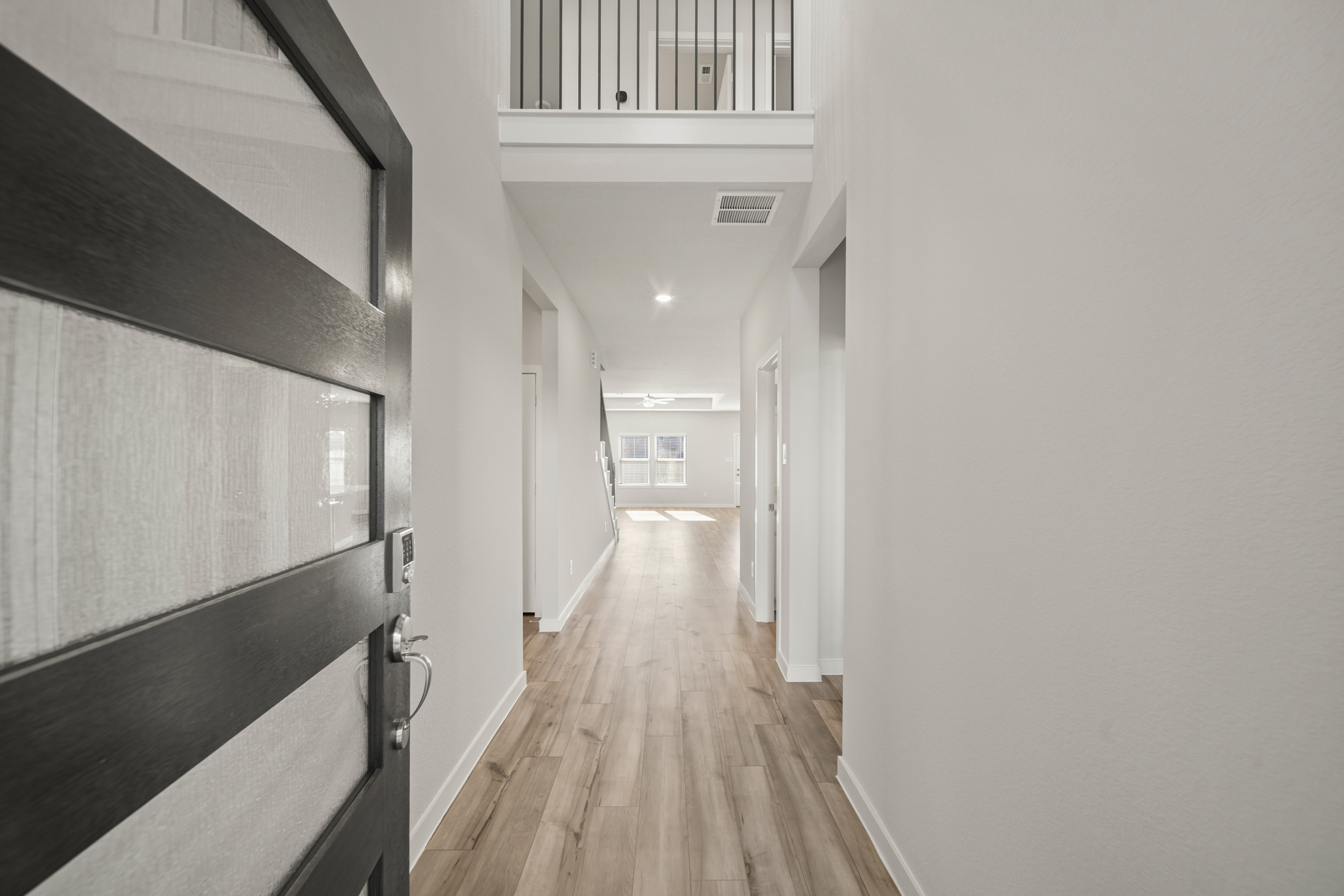 A hallway with white walls.