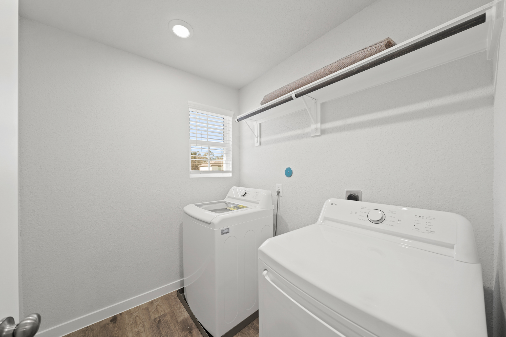 A washer and dryer in a room.