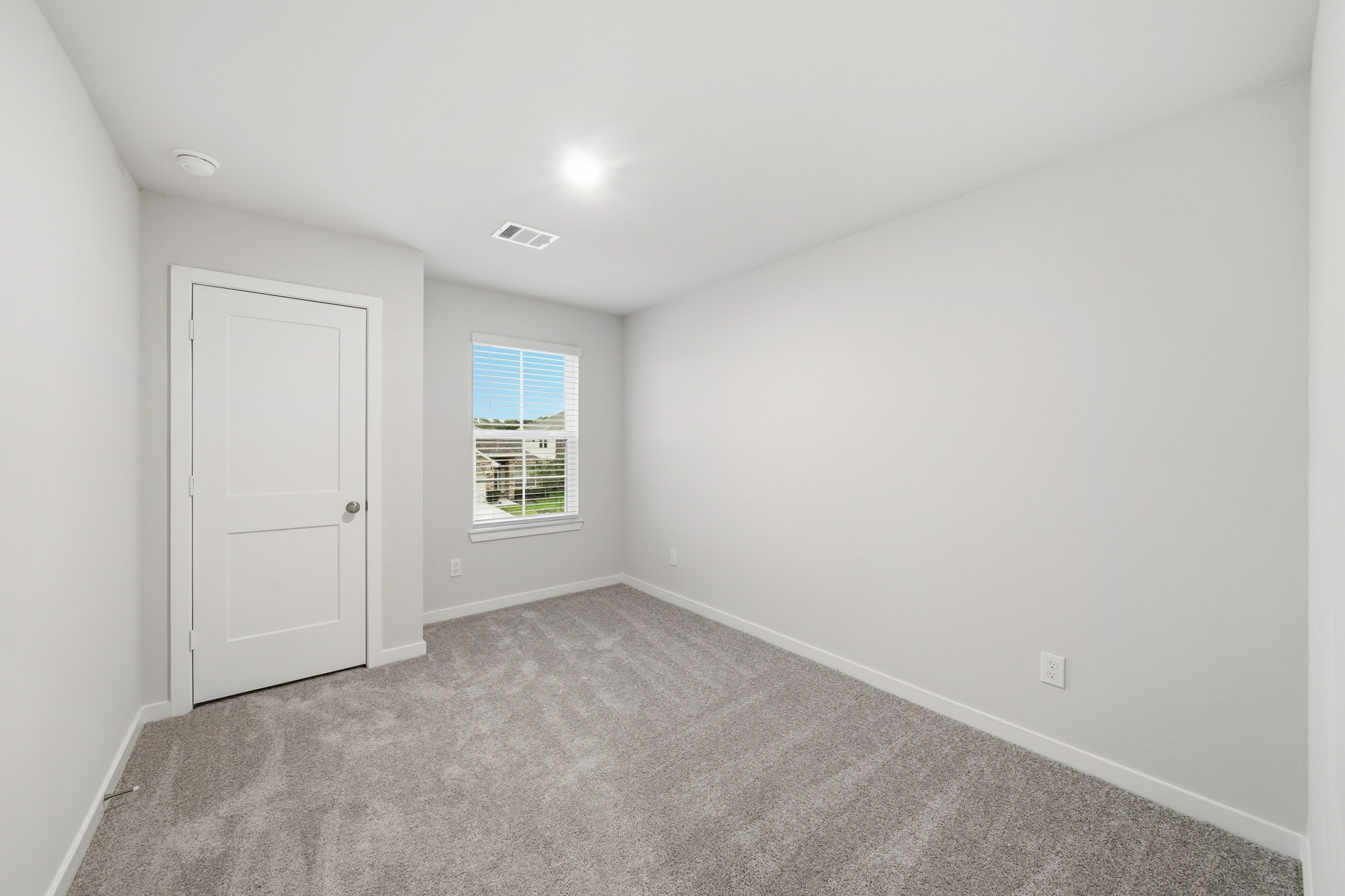 A room with a door and a window.