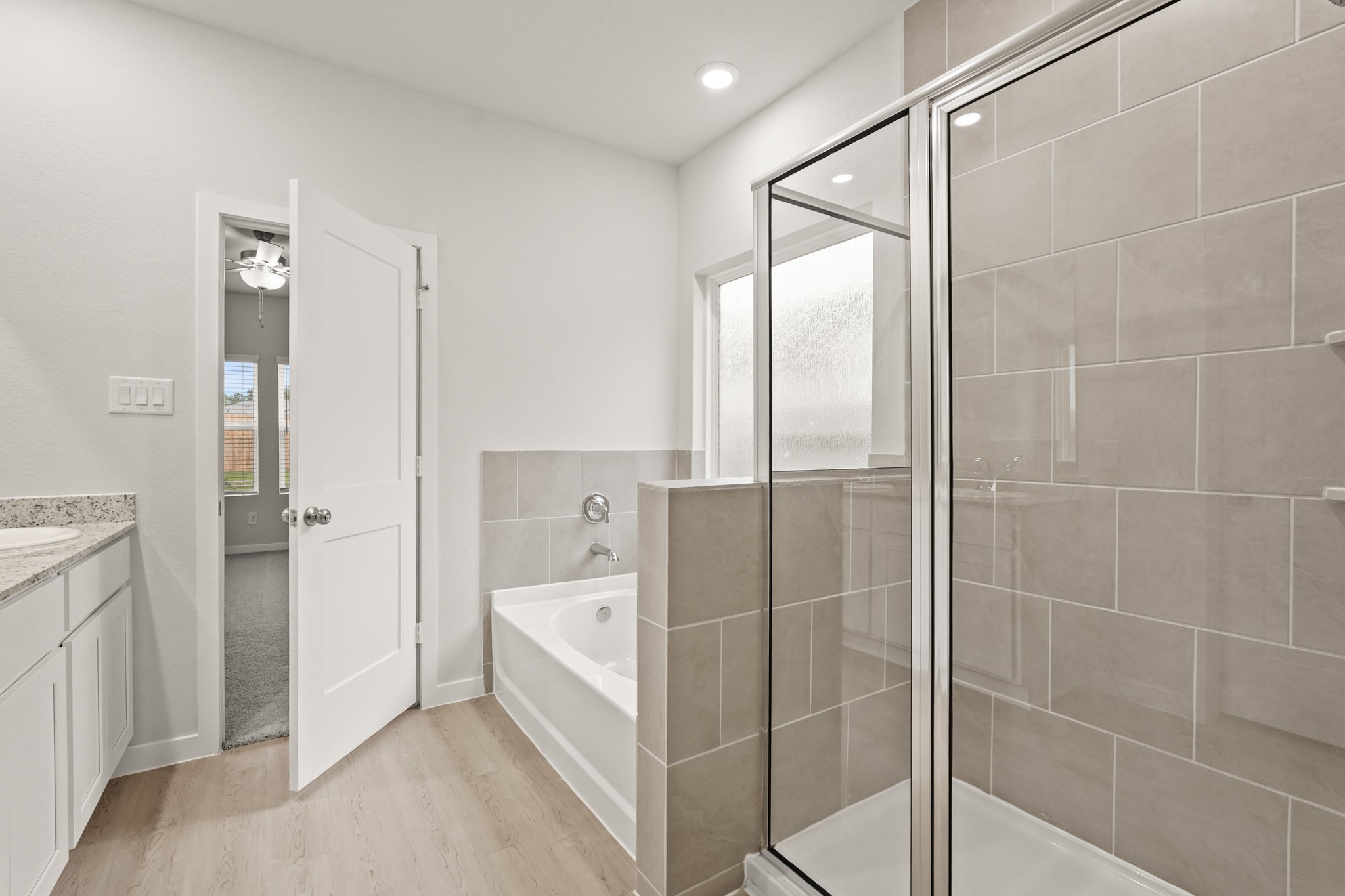 A bathroom with a glass shower.