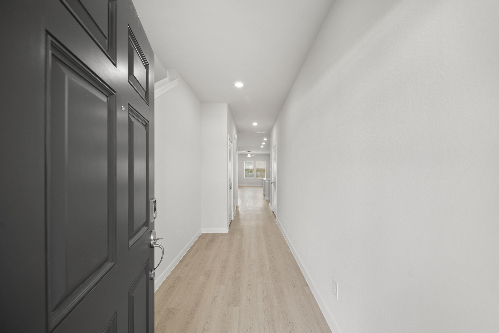 A hallway with white walls.