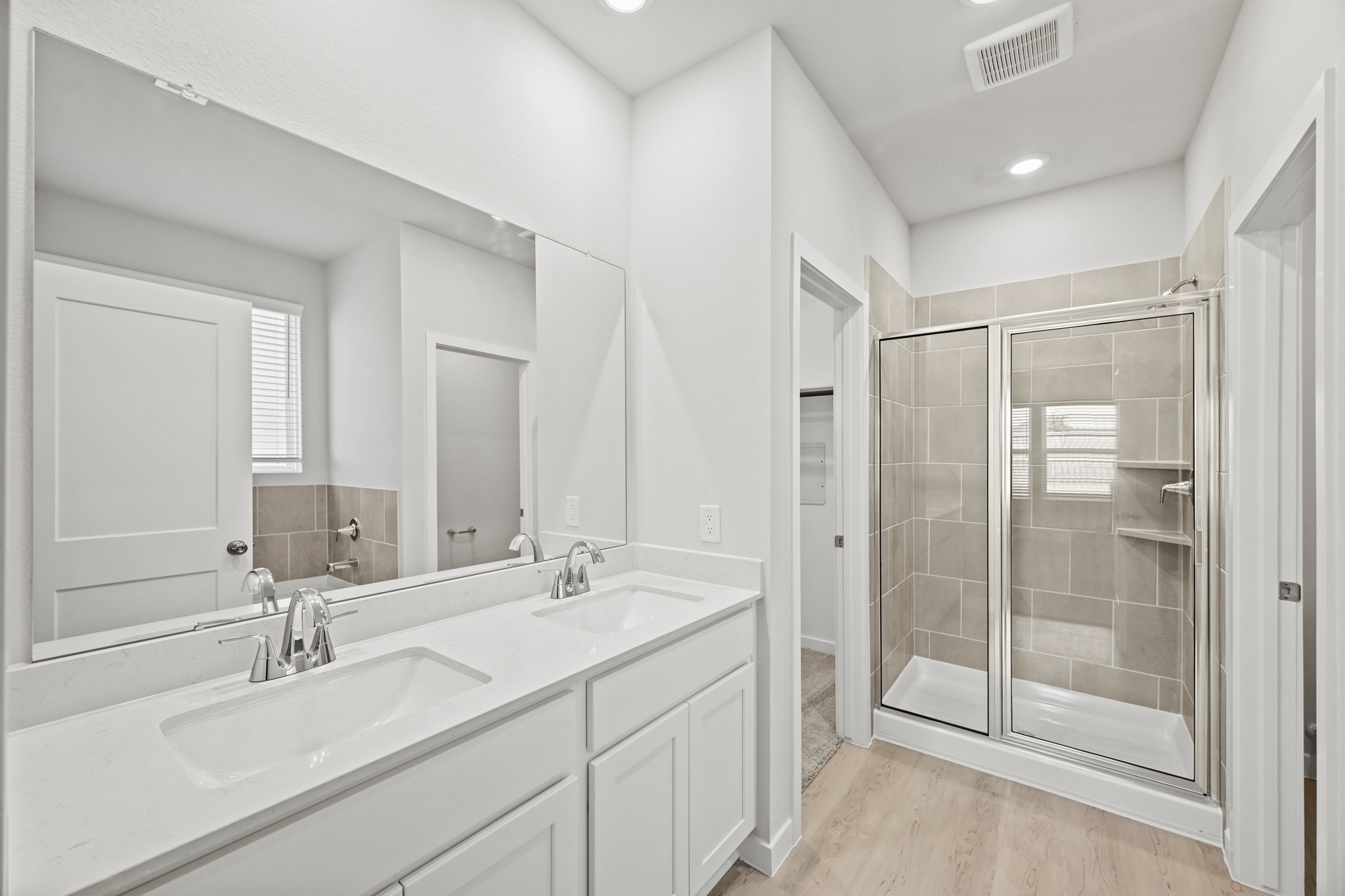 A bathroom with a glass shower.