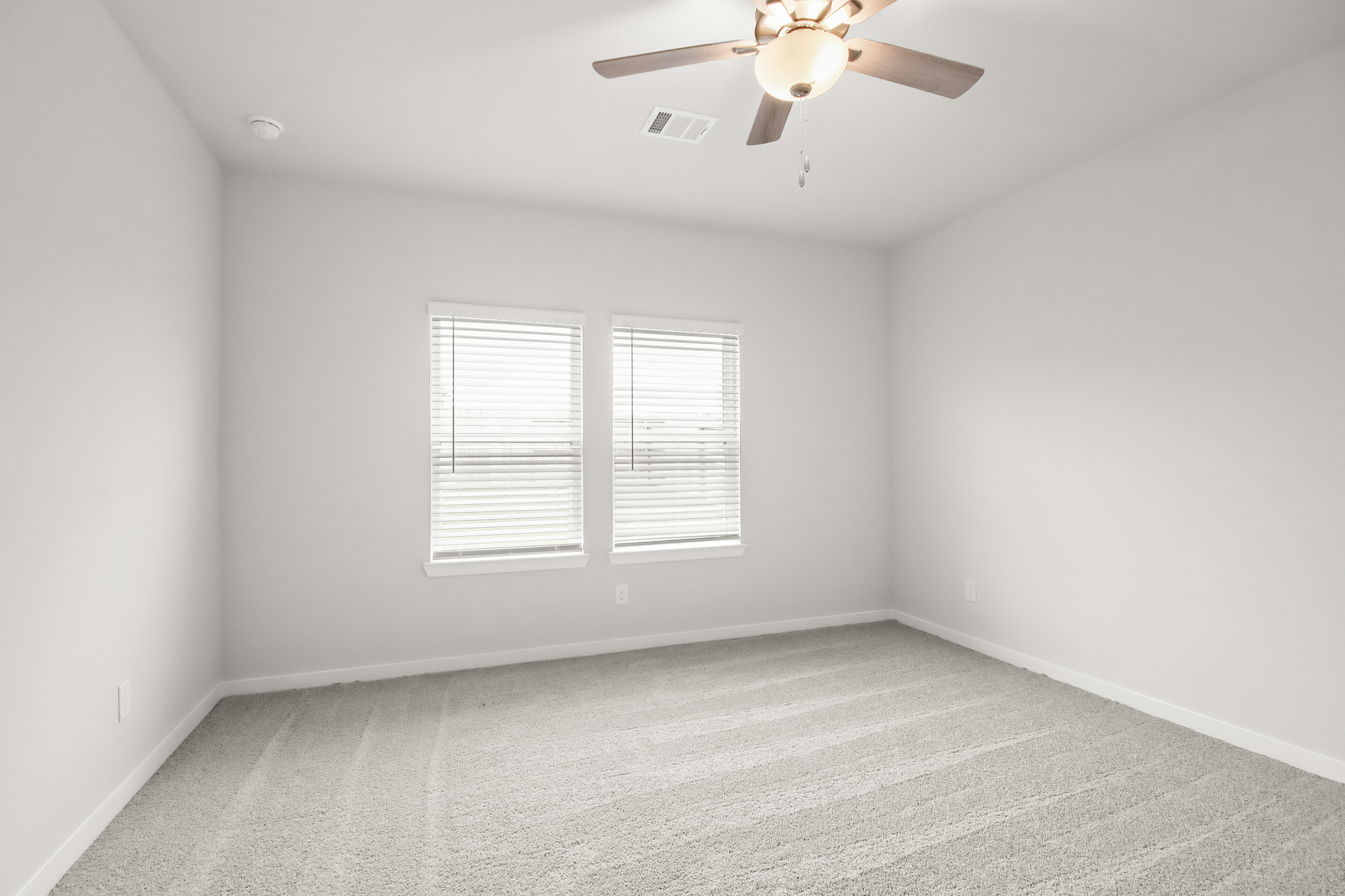 A ceiling fan in a room.