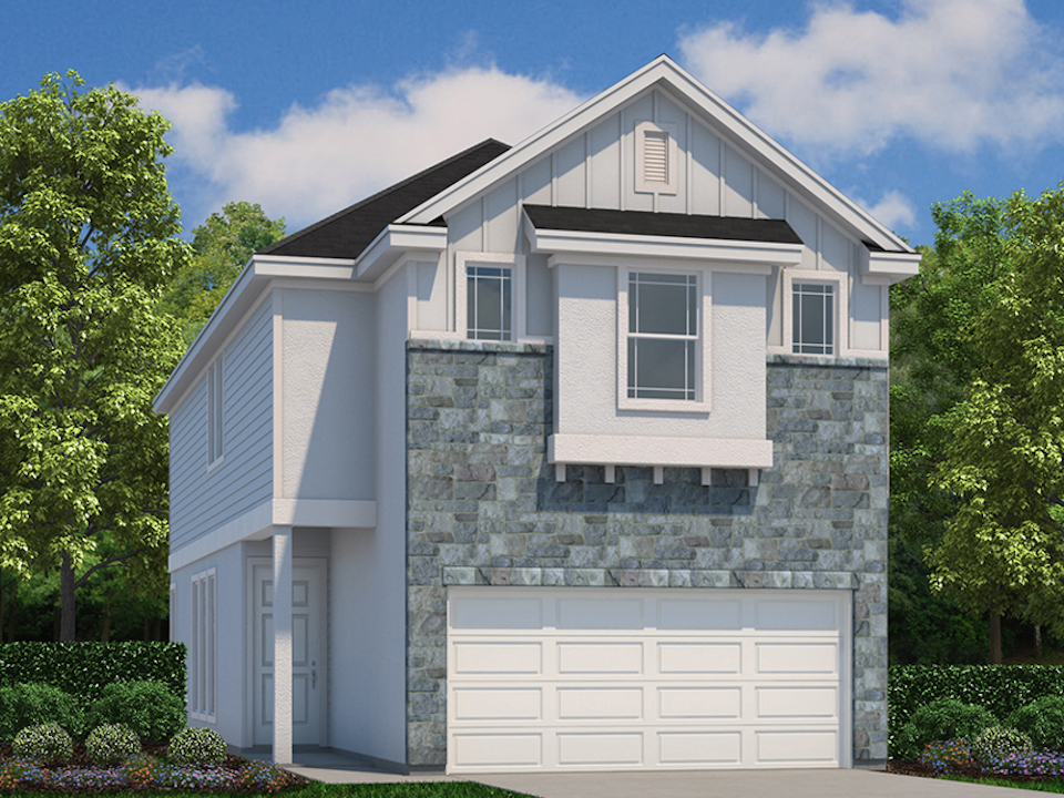 A grey house with a white garage.