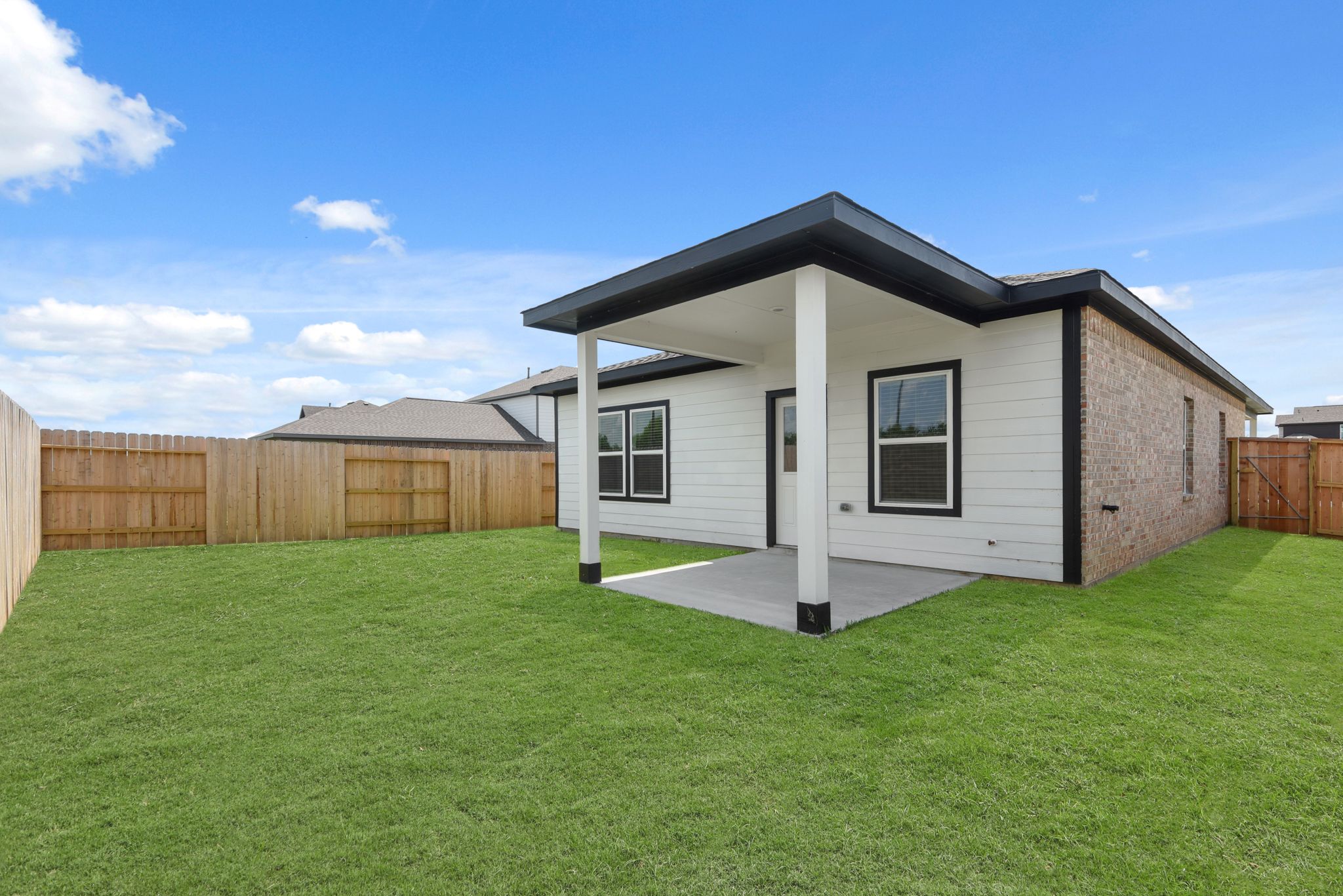 A house with a grass yard.