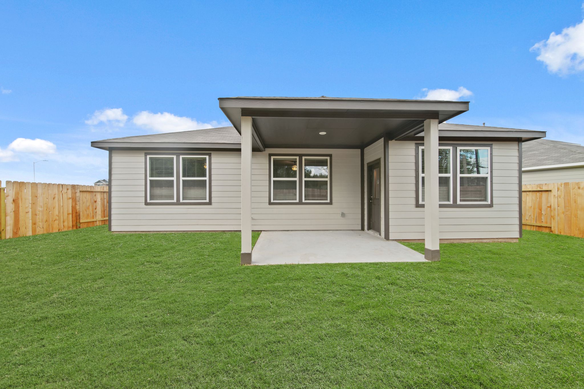 A house with a grass yard.