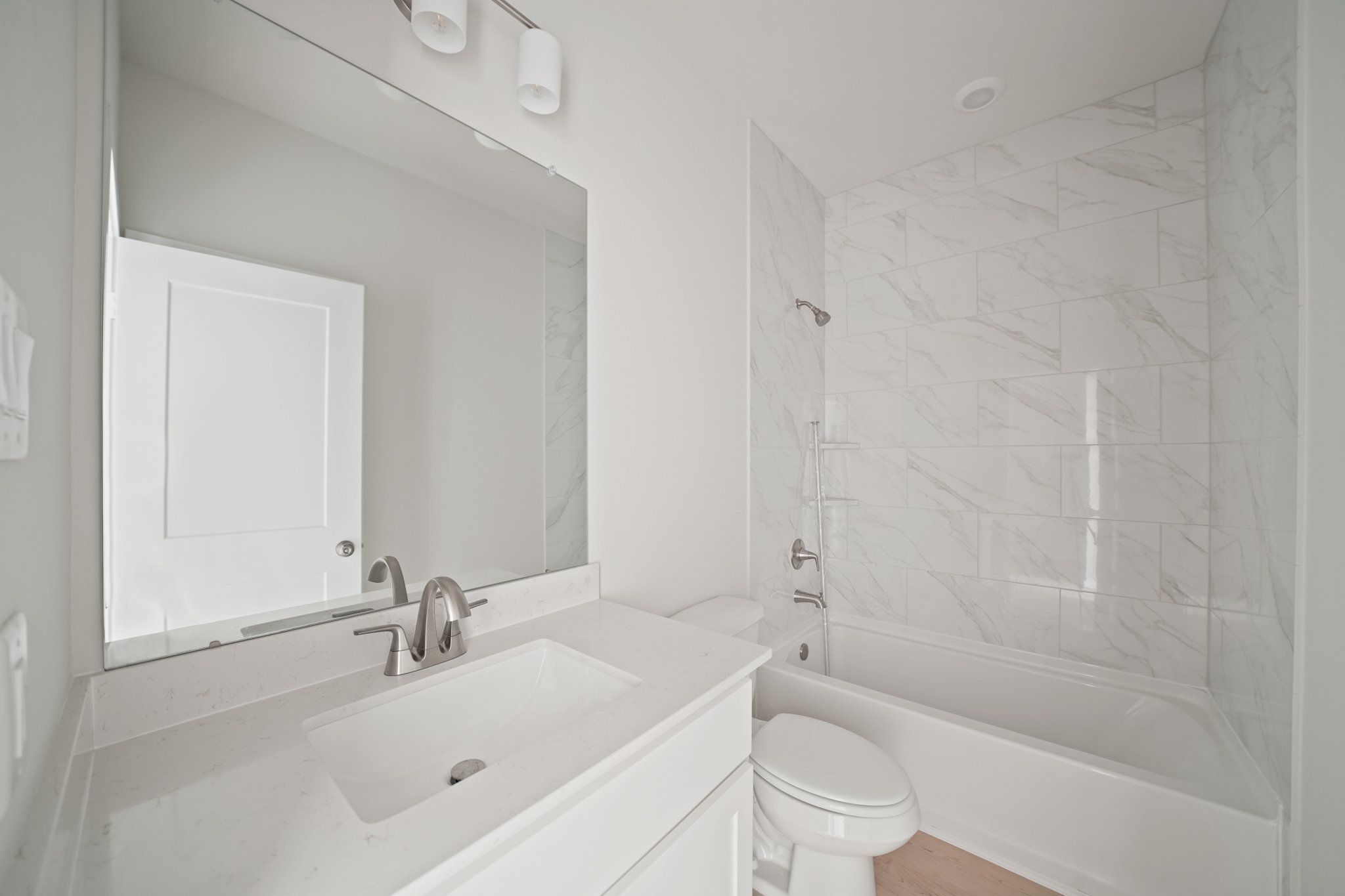 A bathroom with a sink and toilet.