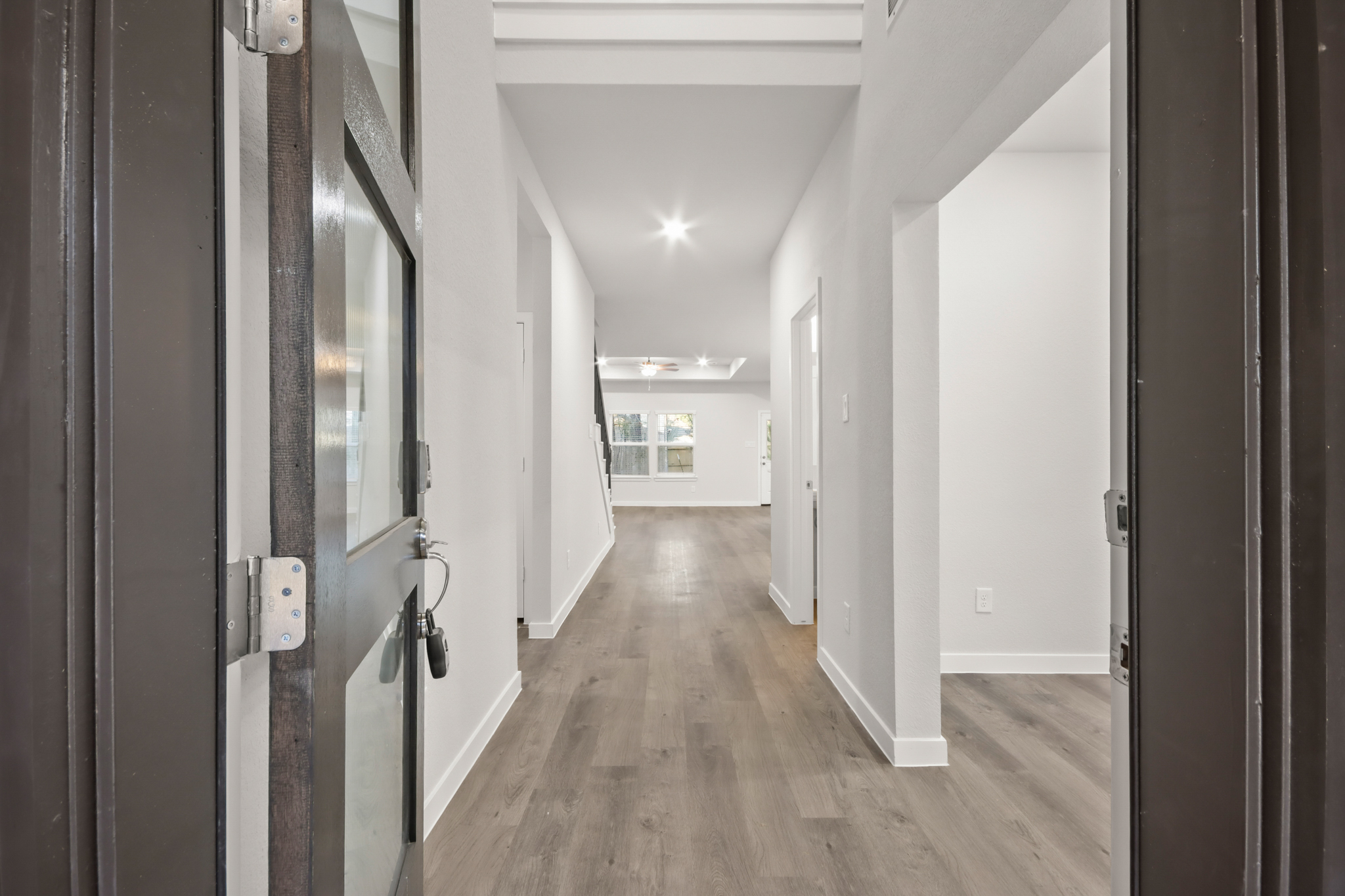 A hallway with white walls.