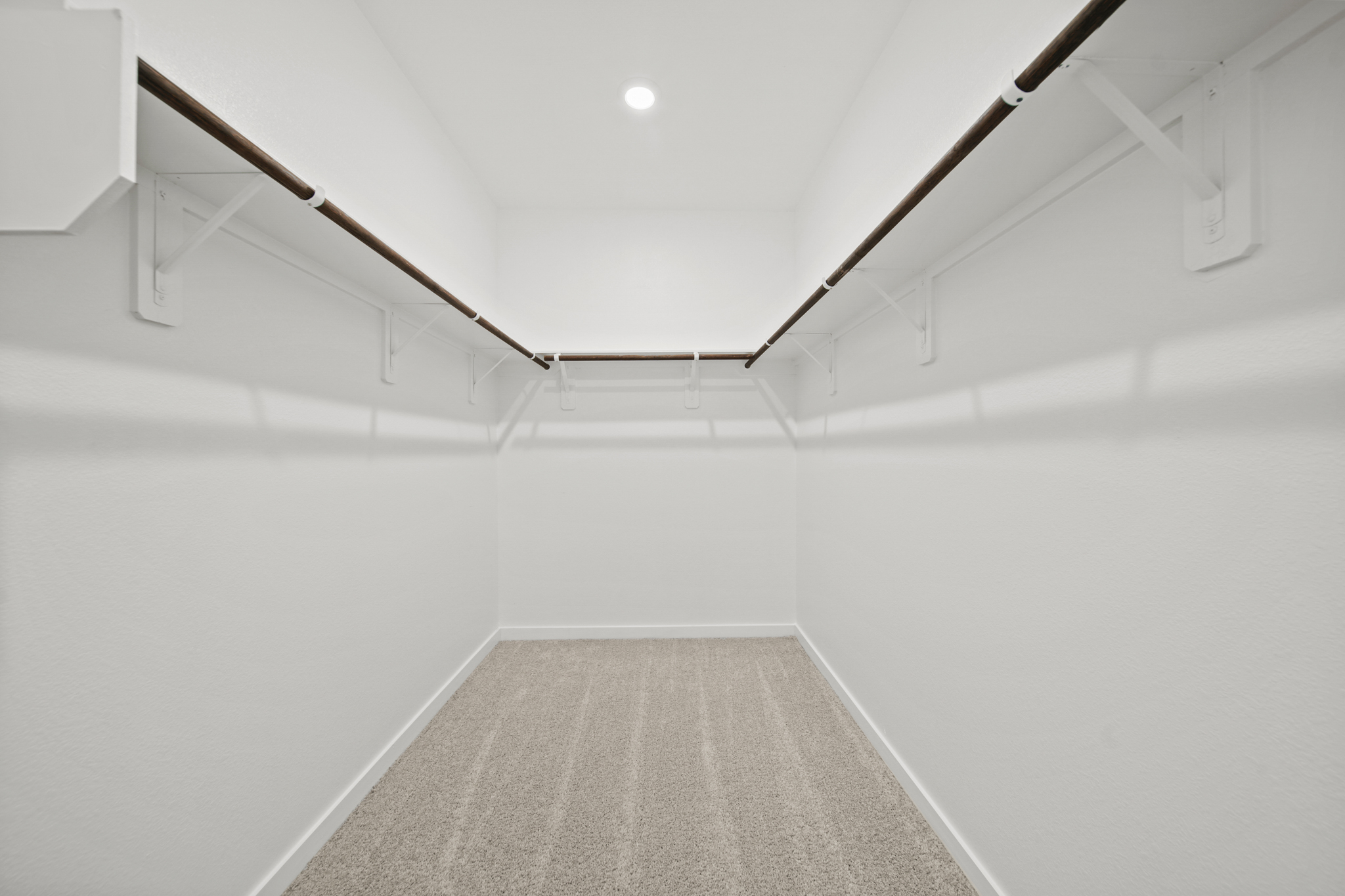 A hallway with white walls.