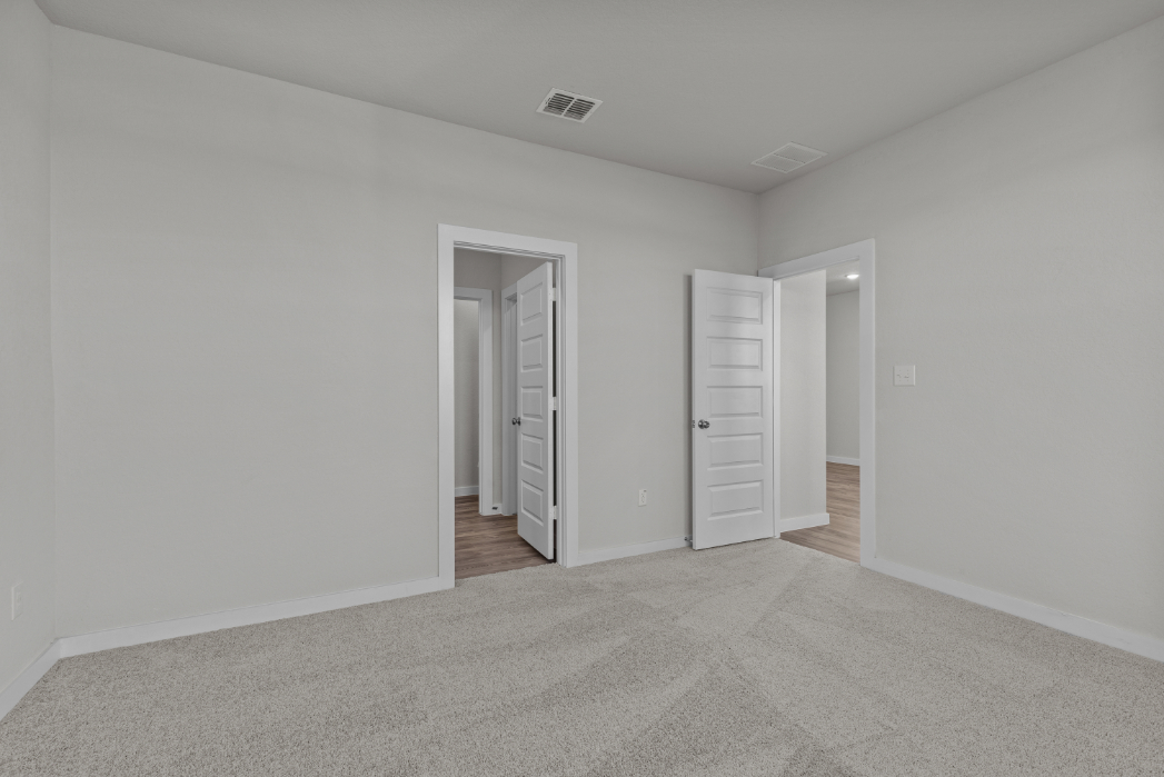 A hallway with white walls.