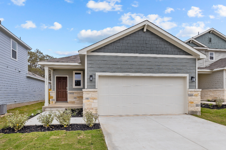 A house with a garage with American Gothic House in the background.