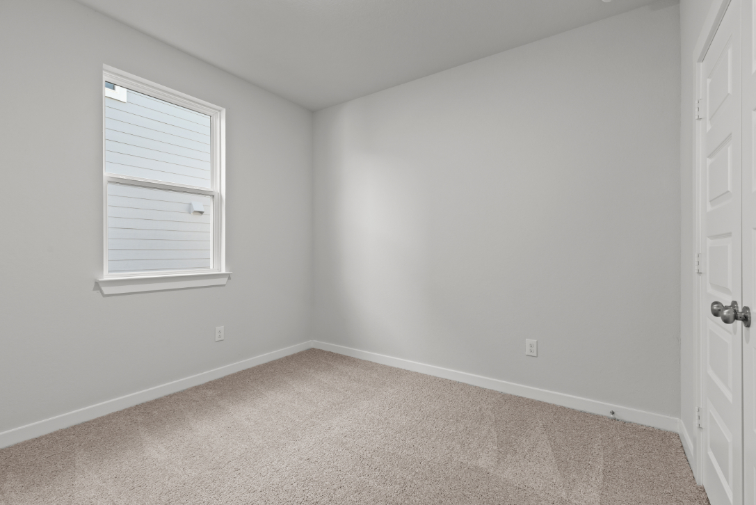 A room with a door and a window.