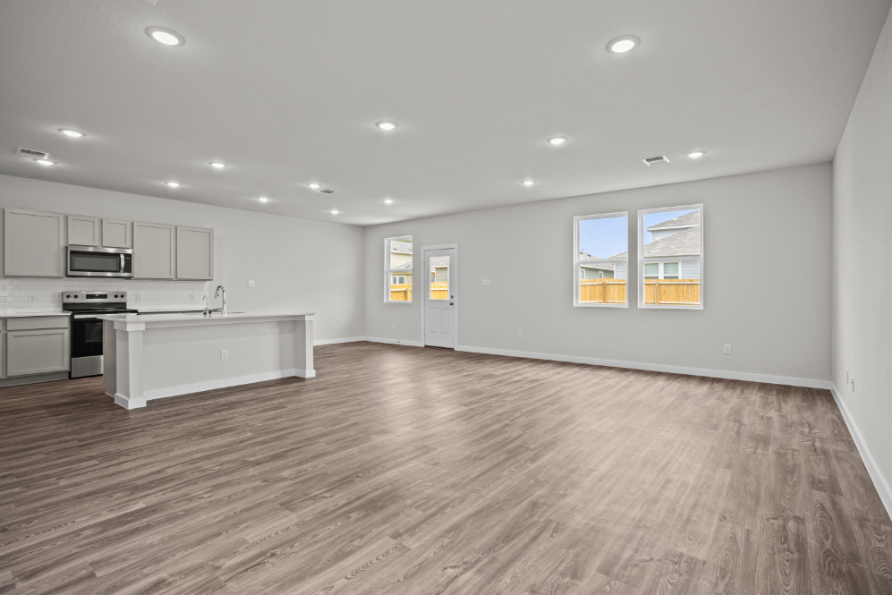 A large kitchen with white cabinets.